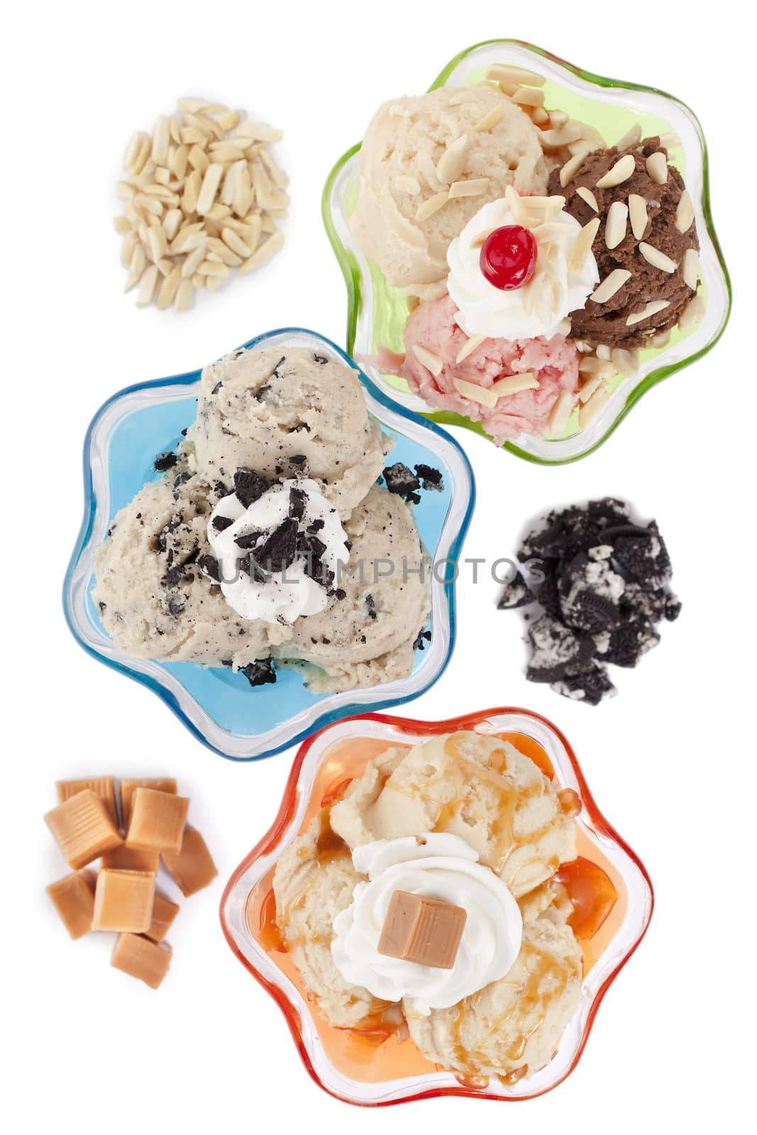 Image top view image of three assorted flavors of ice cream against white background