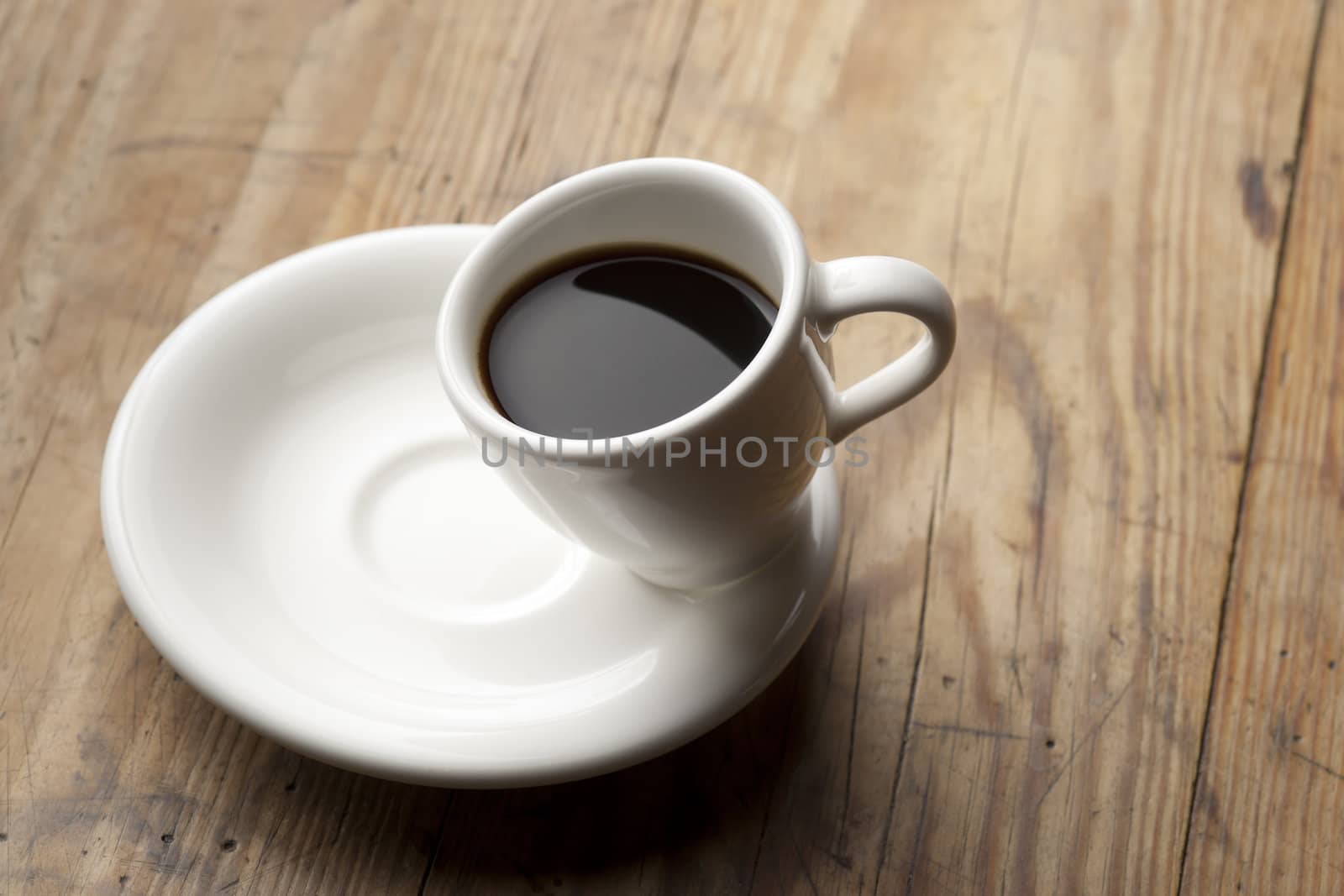 Tilted coffee cup. by Pietus
