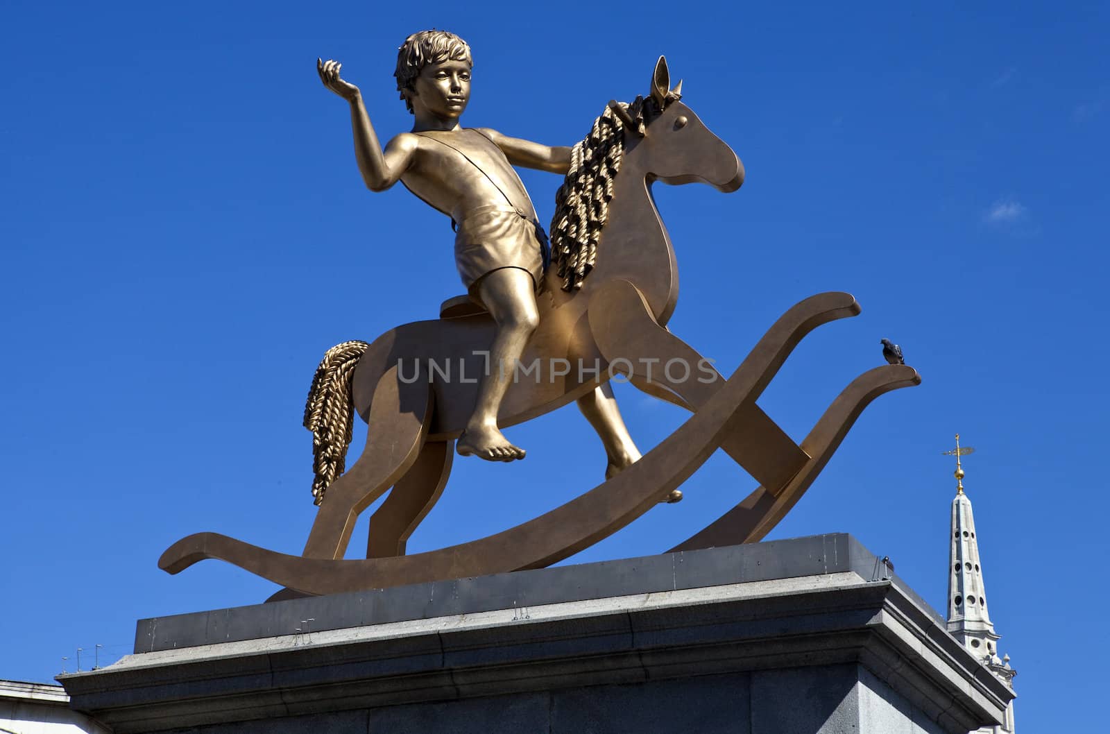 A statue of a boy on a rocking horse (known as Powerless Structures) on Trafalgar Square's fourth plinth in London.