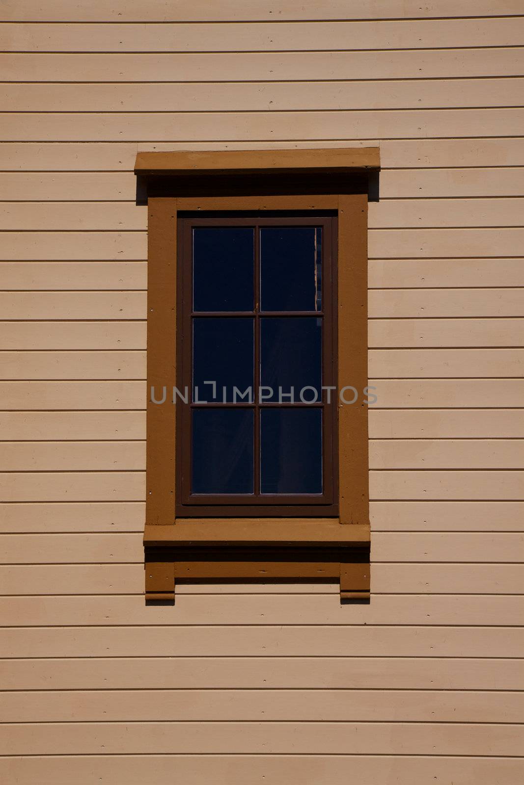 Nordic architectural detail of wall made of wooden planks with small window
