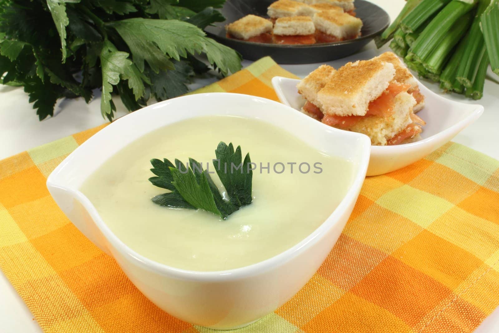 a bowl of Cream of celery soup with salmon croutons