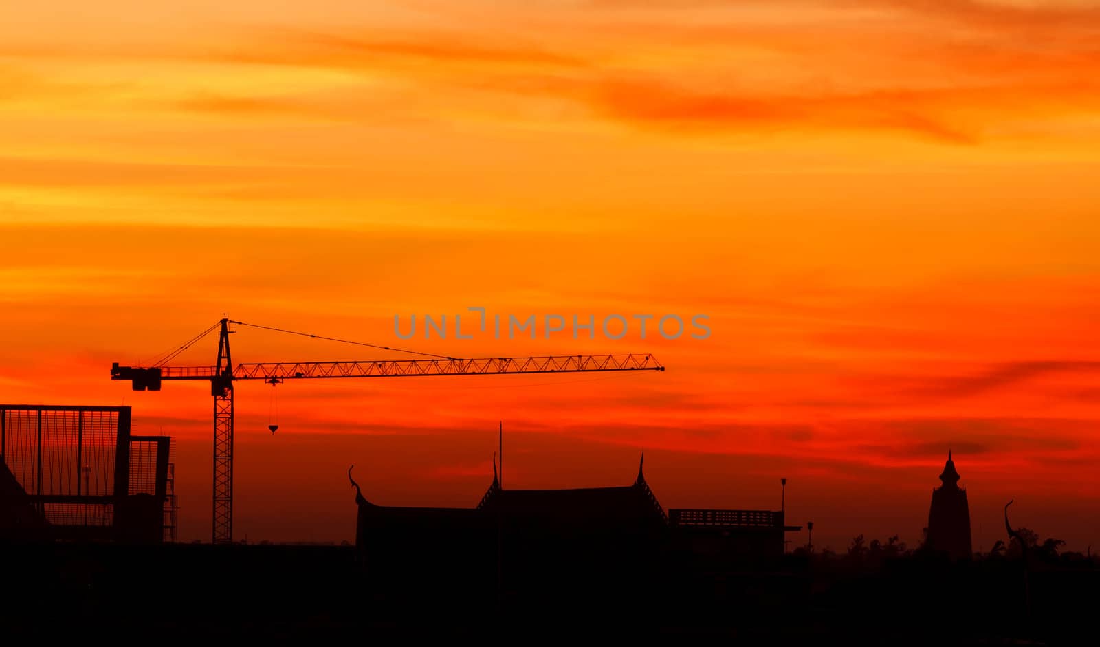 Industrial construction cranes and building at sunrise by jame_j@homail.com