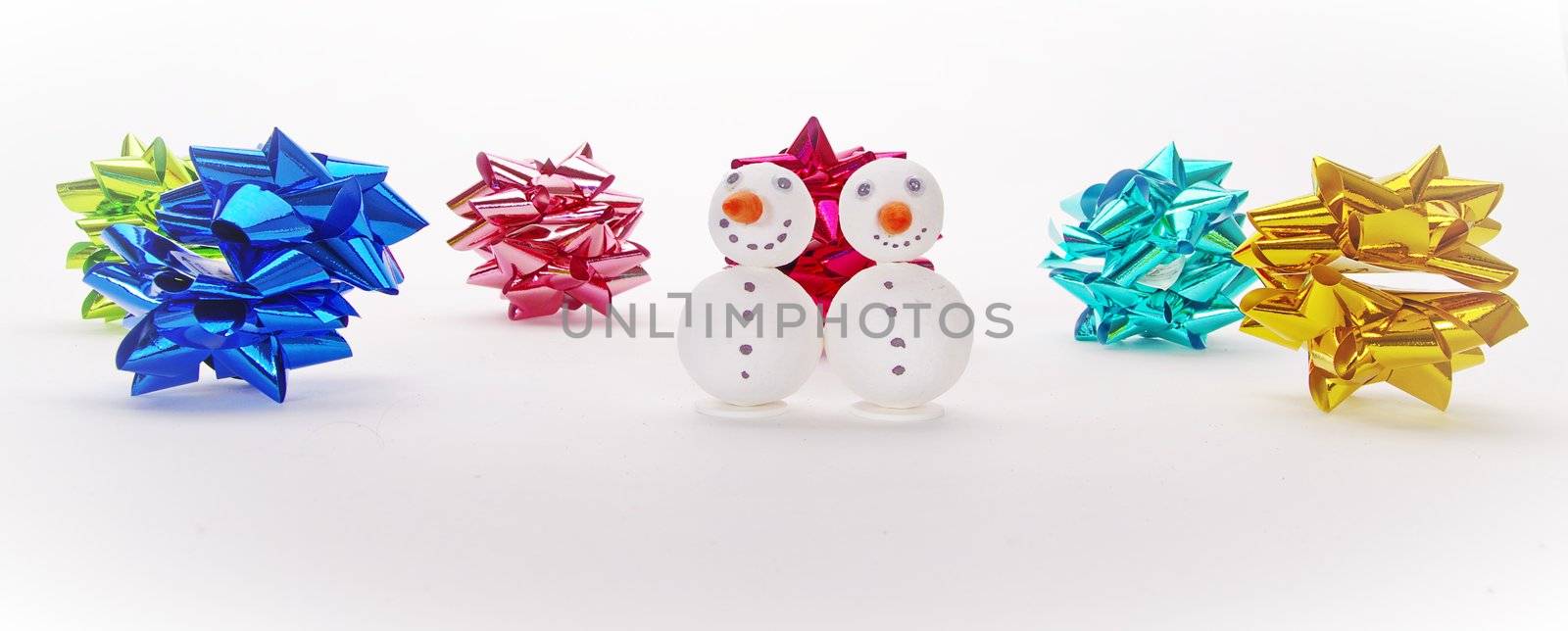 many funny selfmade snowmen isolated on white background