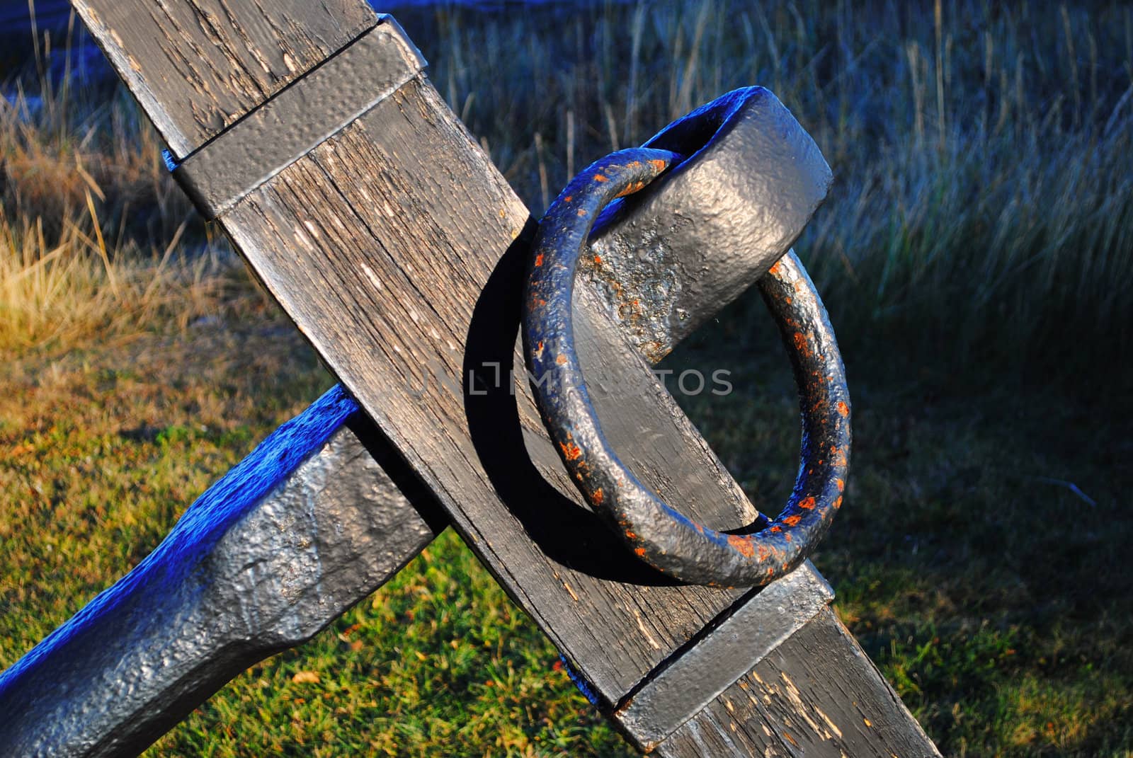 A decorative anchor in a garden.