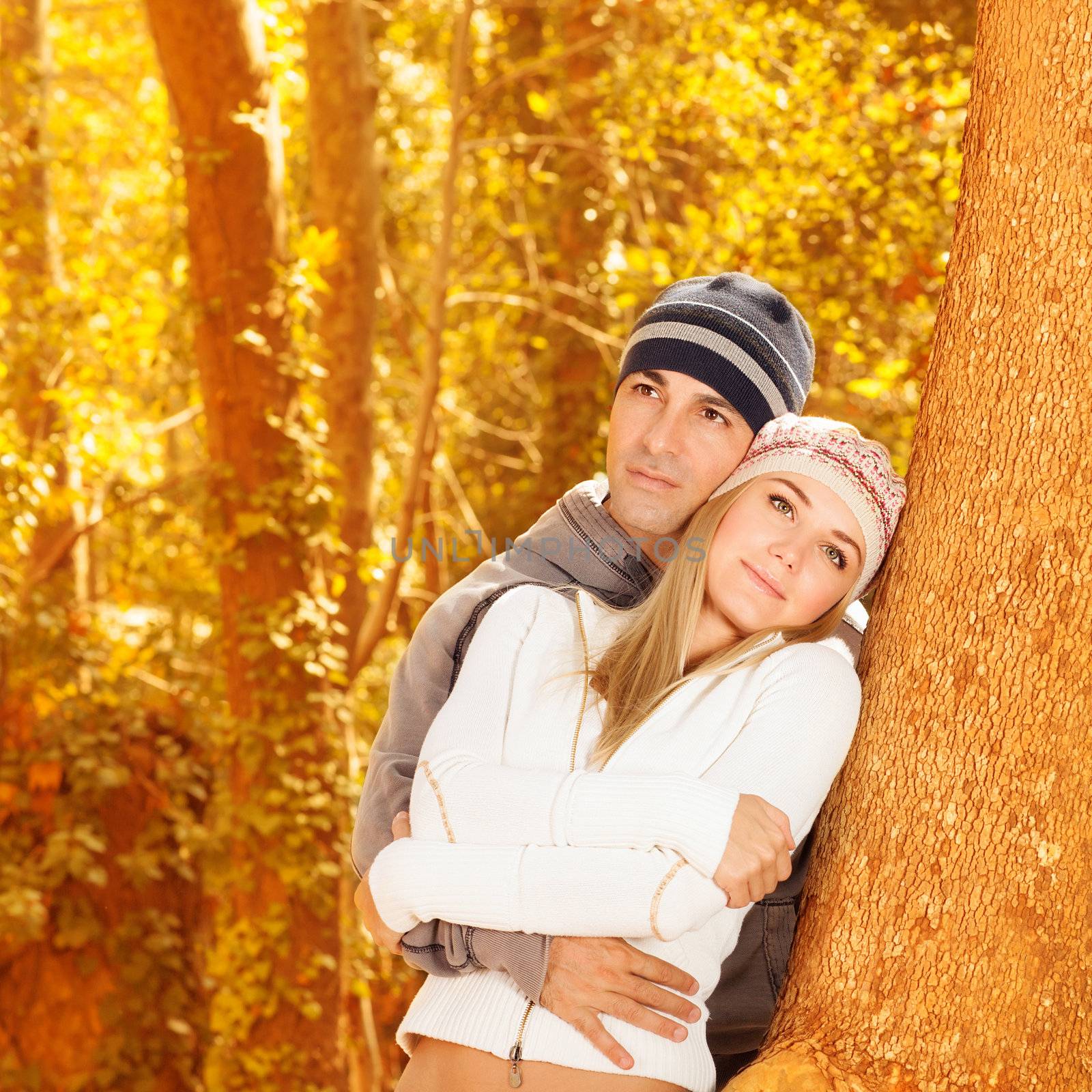 Happy couple in autumn woods by Anna_Omelchenko