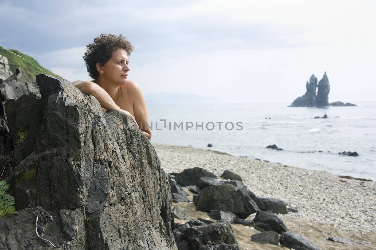woman relaxing the bank of Japan Sea