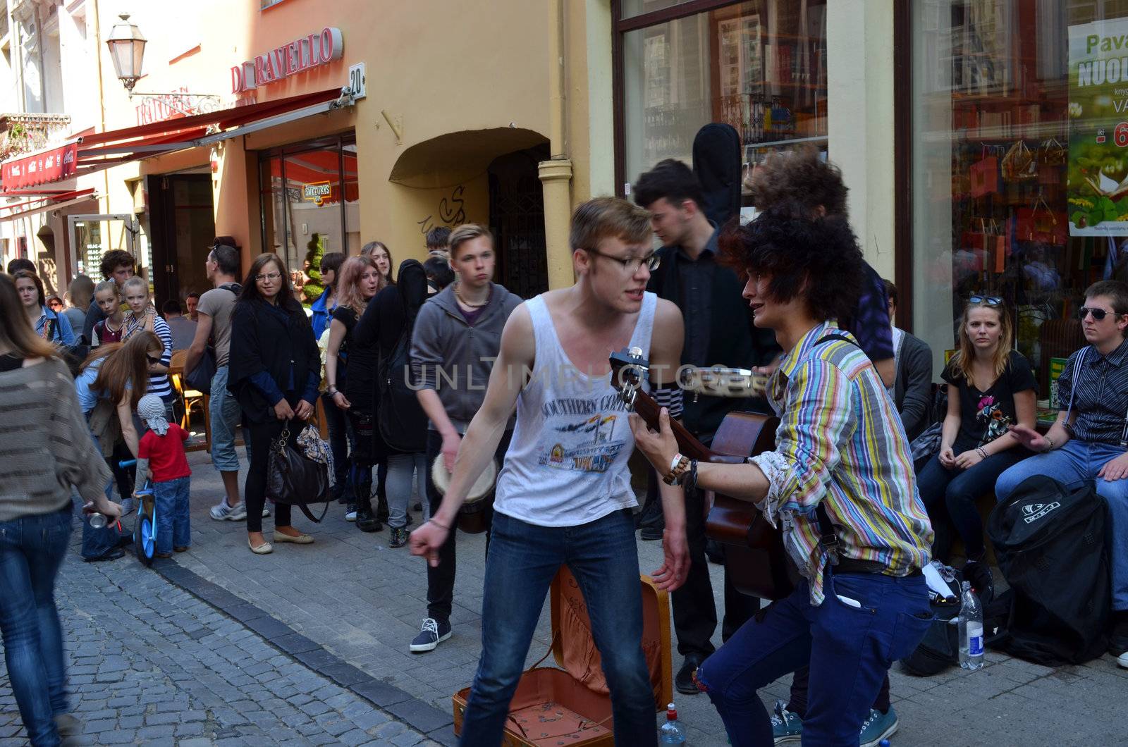 VILNIUS, LITHUANIA - MAY 19: Young unidentified students playing guitar and singing on May 19, 2012 on Vilnius. Street Music Day.