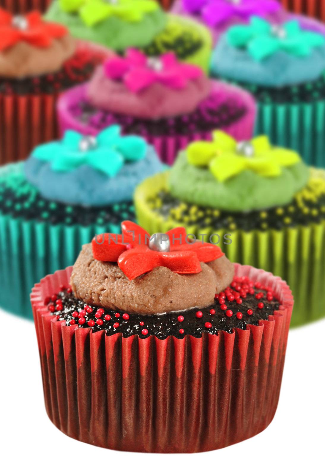 Chocolate cupcakes in colorful cups by tish1