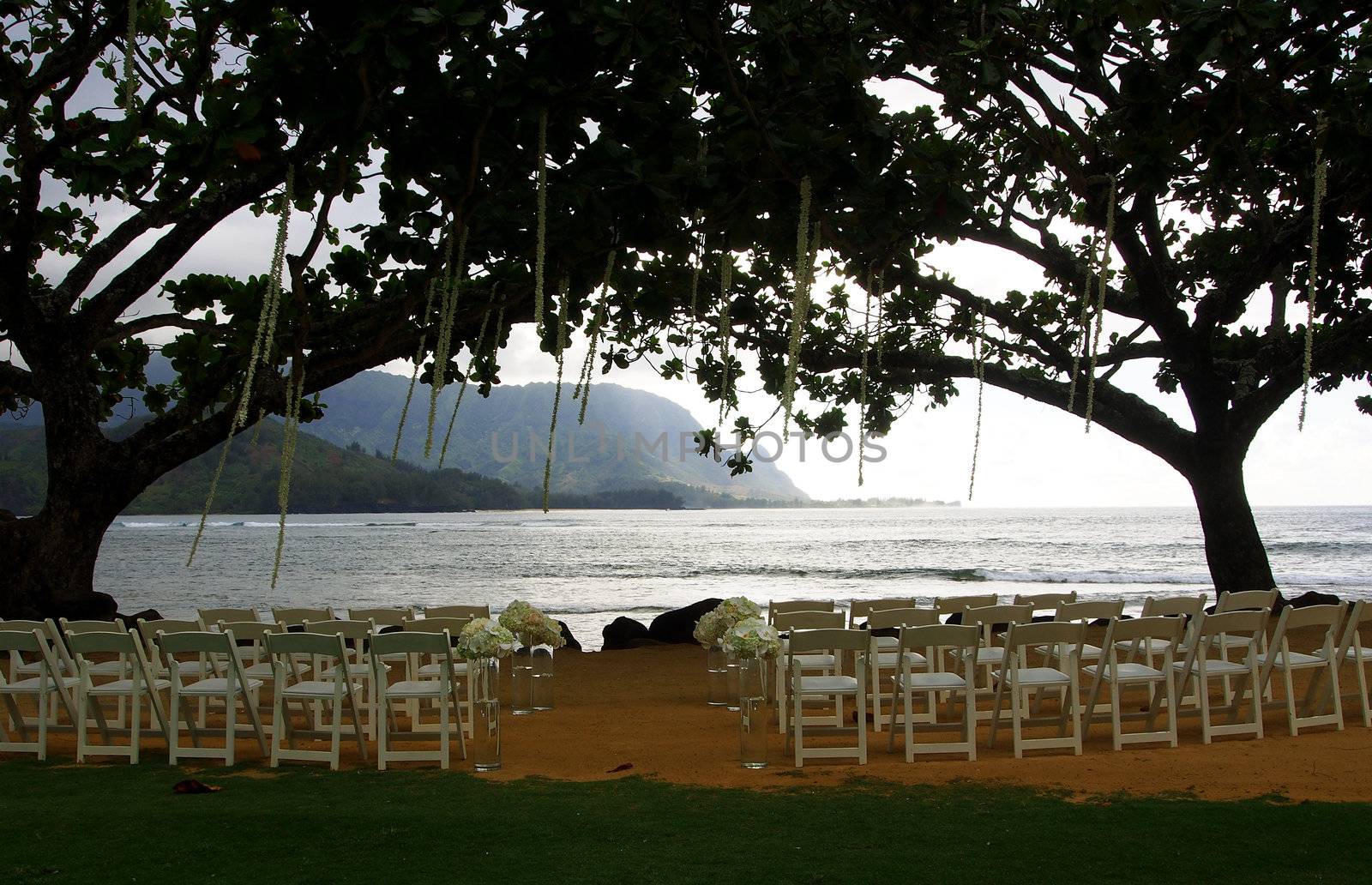 wedding ceremony set up on the beach at dusk