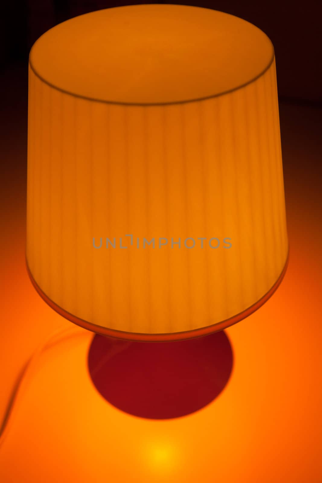 Orange lampshade on an orange background