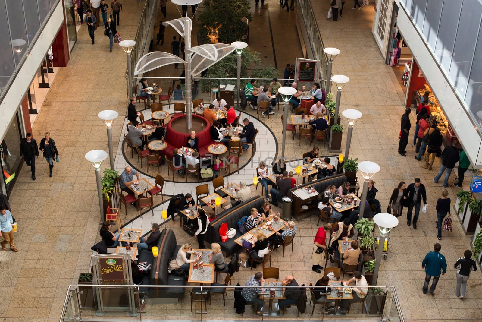 AUGSBURG – OCTOBER 20: People are shopping and resting in the City Galerie shopping mall on October 20,2012 in Augsburg, Germany. The mall was opened 2001 and is serving more than 20,000 people each day within its roughly 100 shops.