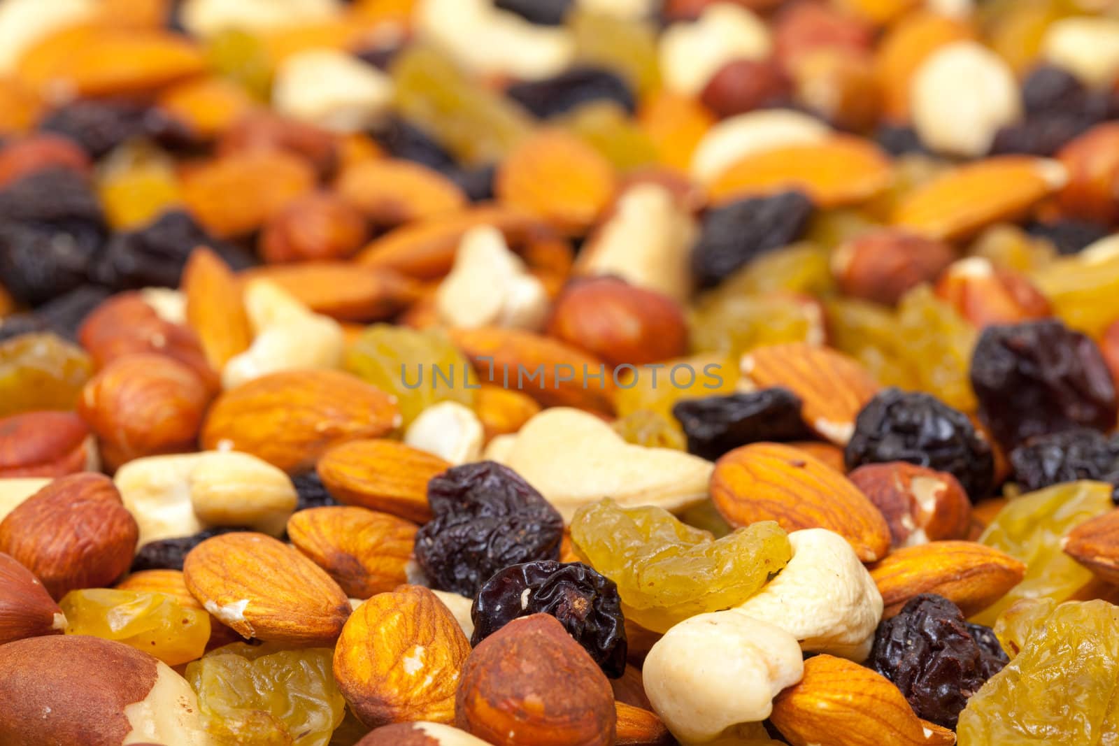 background of mixture of nuts and raisins by Discovod