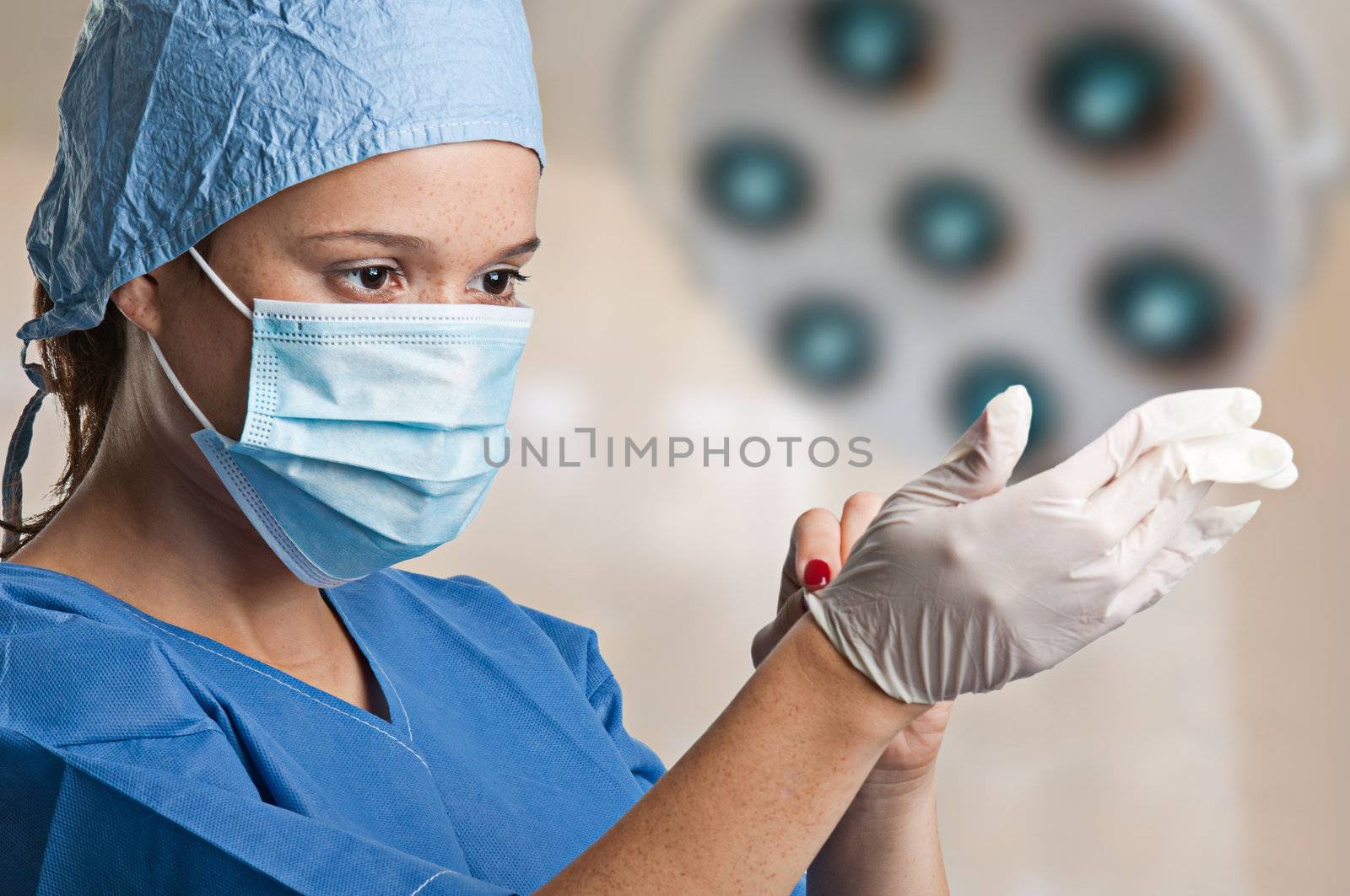 Young female surgeon getting ready for a surgery