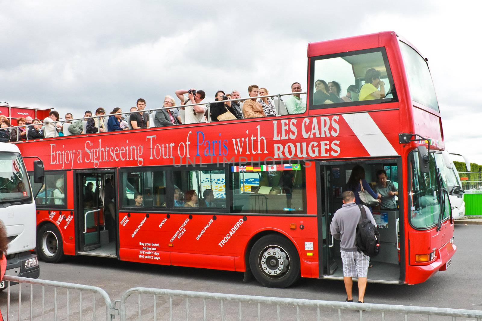 PARIS, FRANCE - JULY 10:Tourists bus in the heart of Paris on July 10, 2012. Paris is one of the most visited cities in the world.