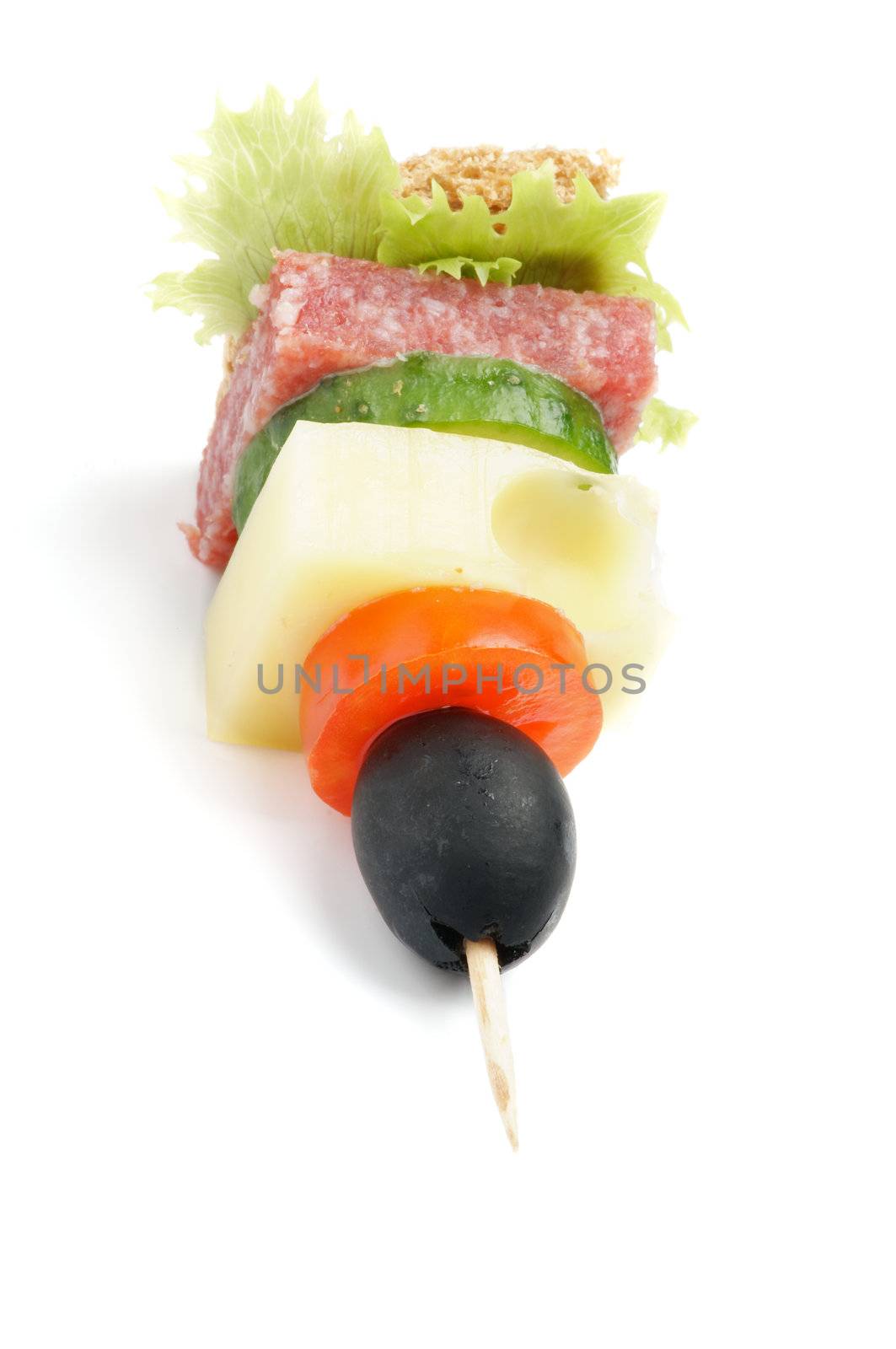 Single Canape with Lettuce, Salami, Tomatoes, Cheese, Cucumber,Black Olive, and Whole Grain Bread isolated on white background