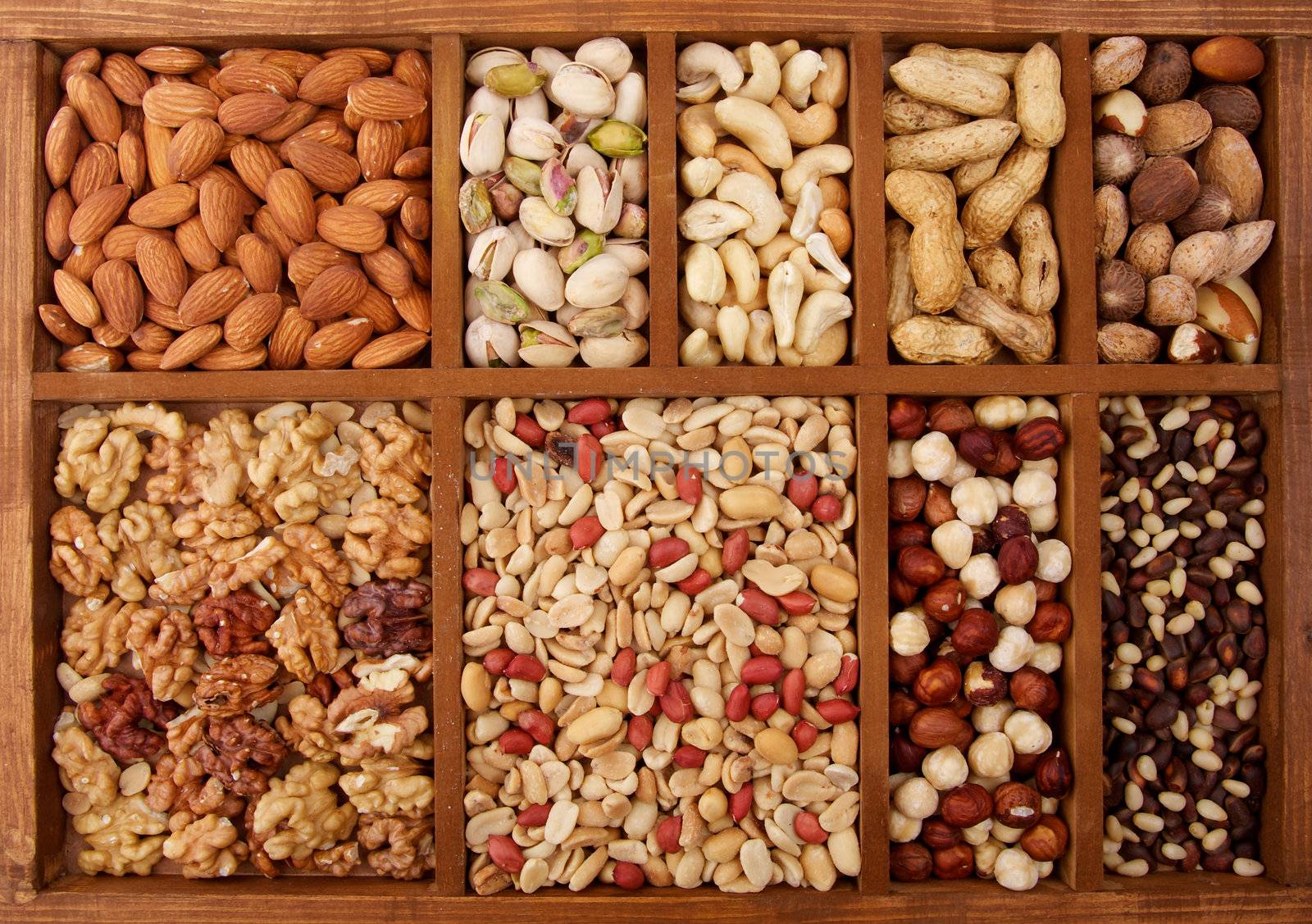 Background of Various Nuts in Wooden Box closeup 