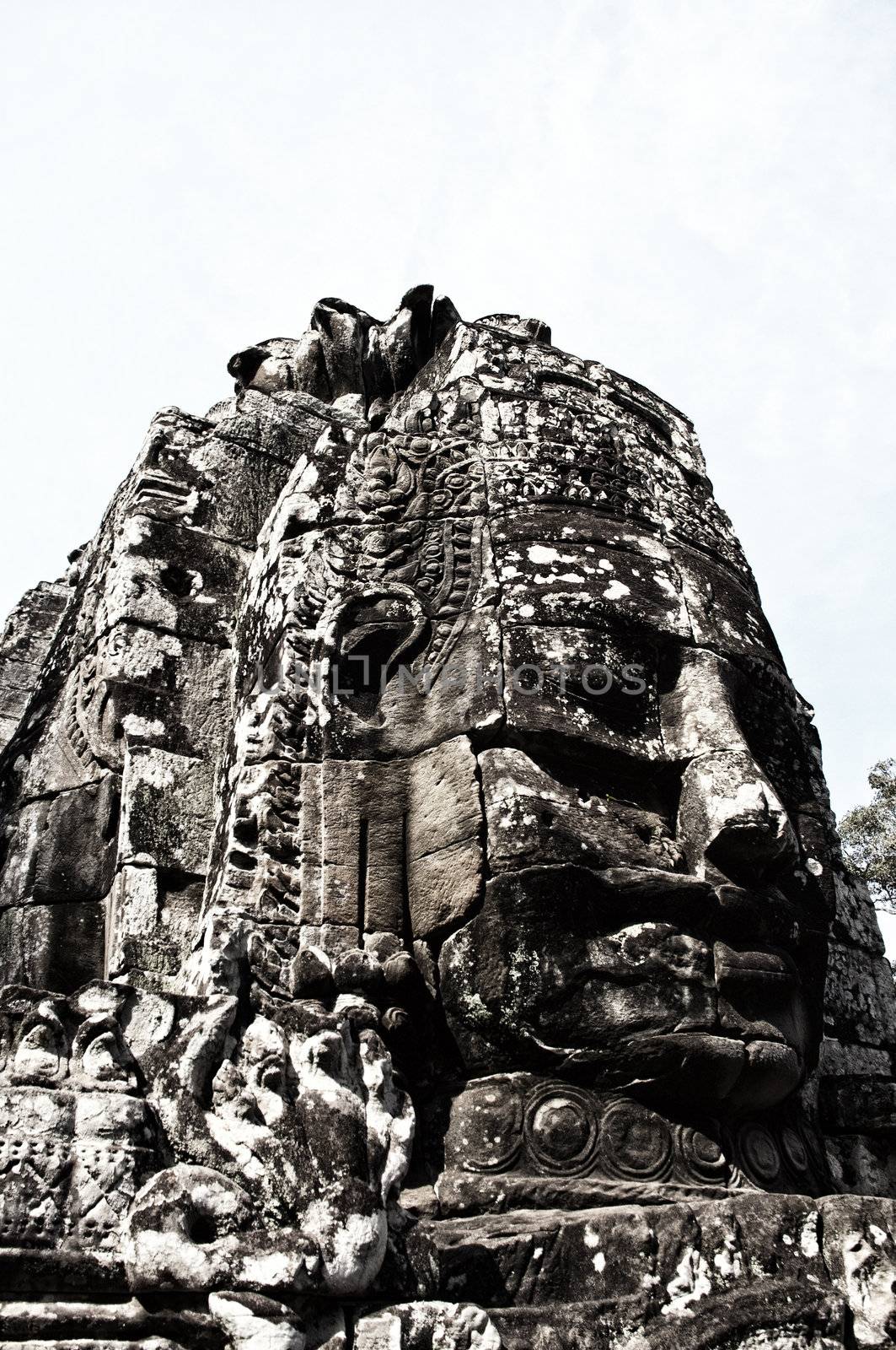 Faces of Bayon temple,Angkor Wat stone carvings of faces,Cambodi by Yuri2012