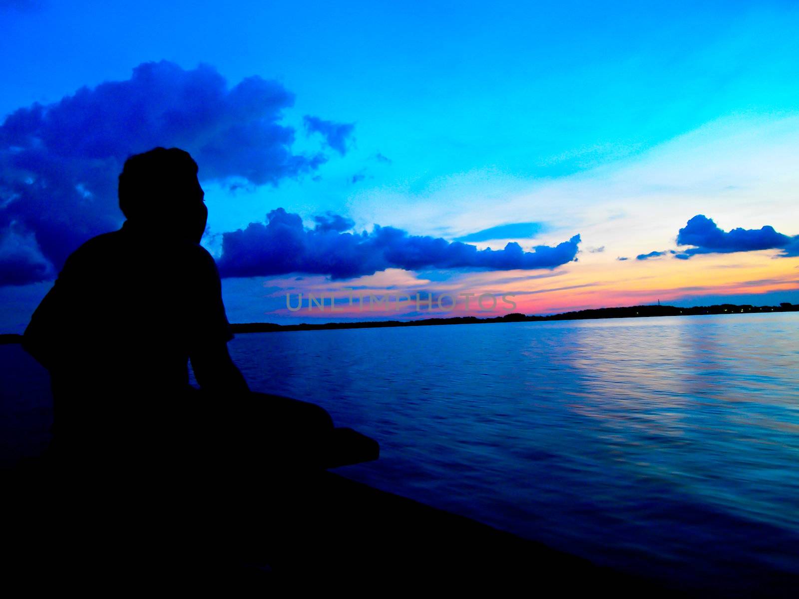 Fisherman in twilight sunset by gjeerawut