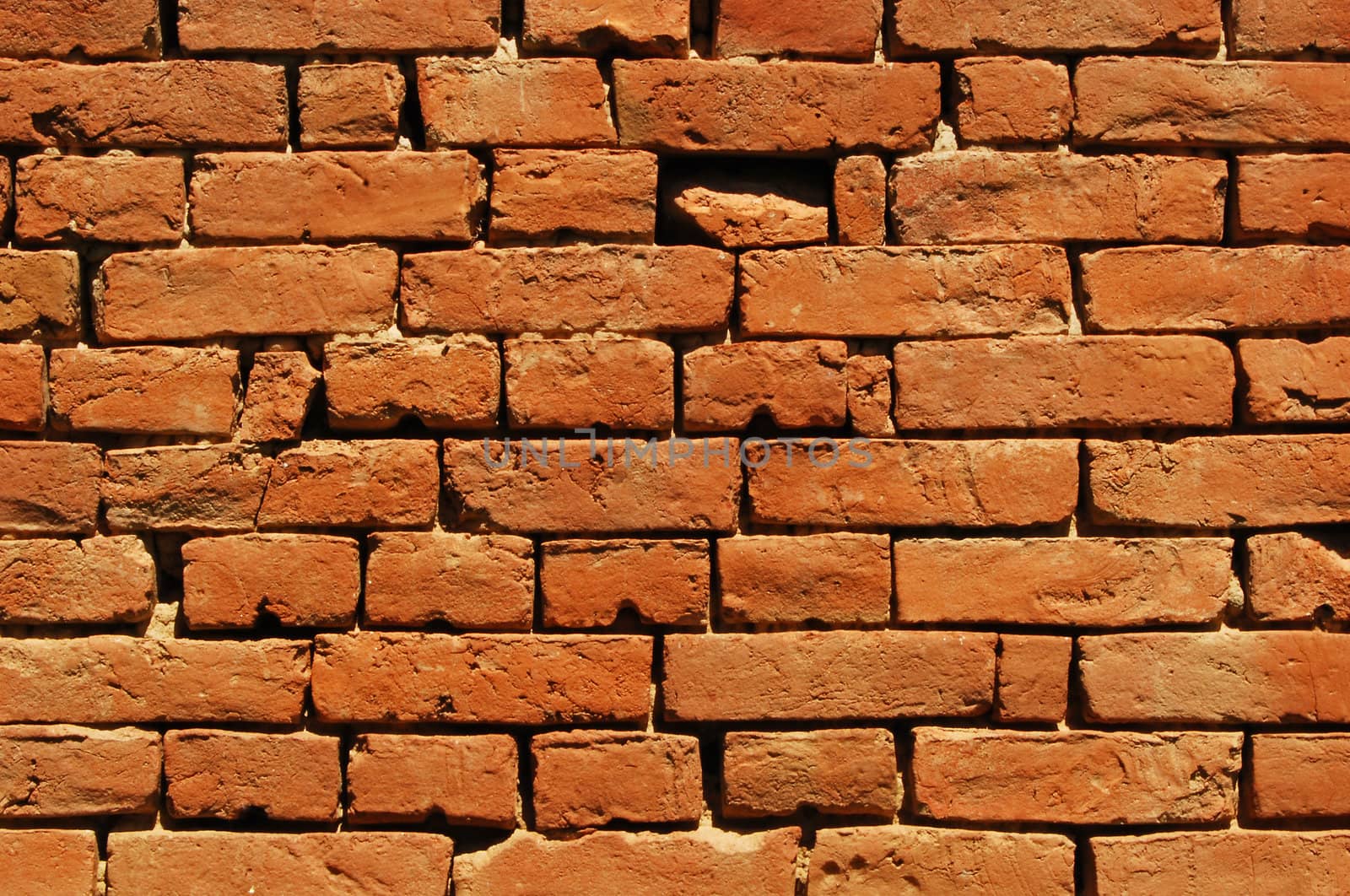 Old country house red bricks wall as background