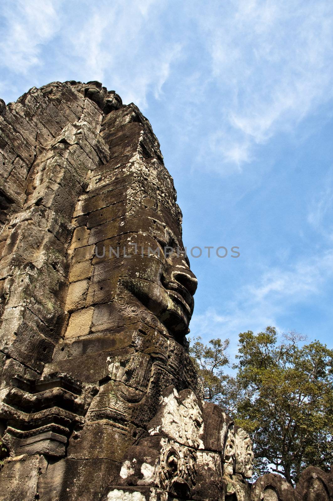 Faces of Bayon temple,Angkor Wat stone carvings of faces,Cambodi by Yuri2012