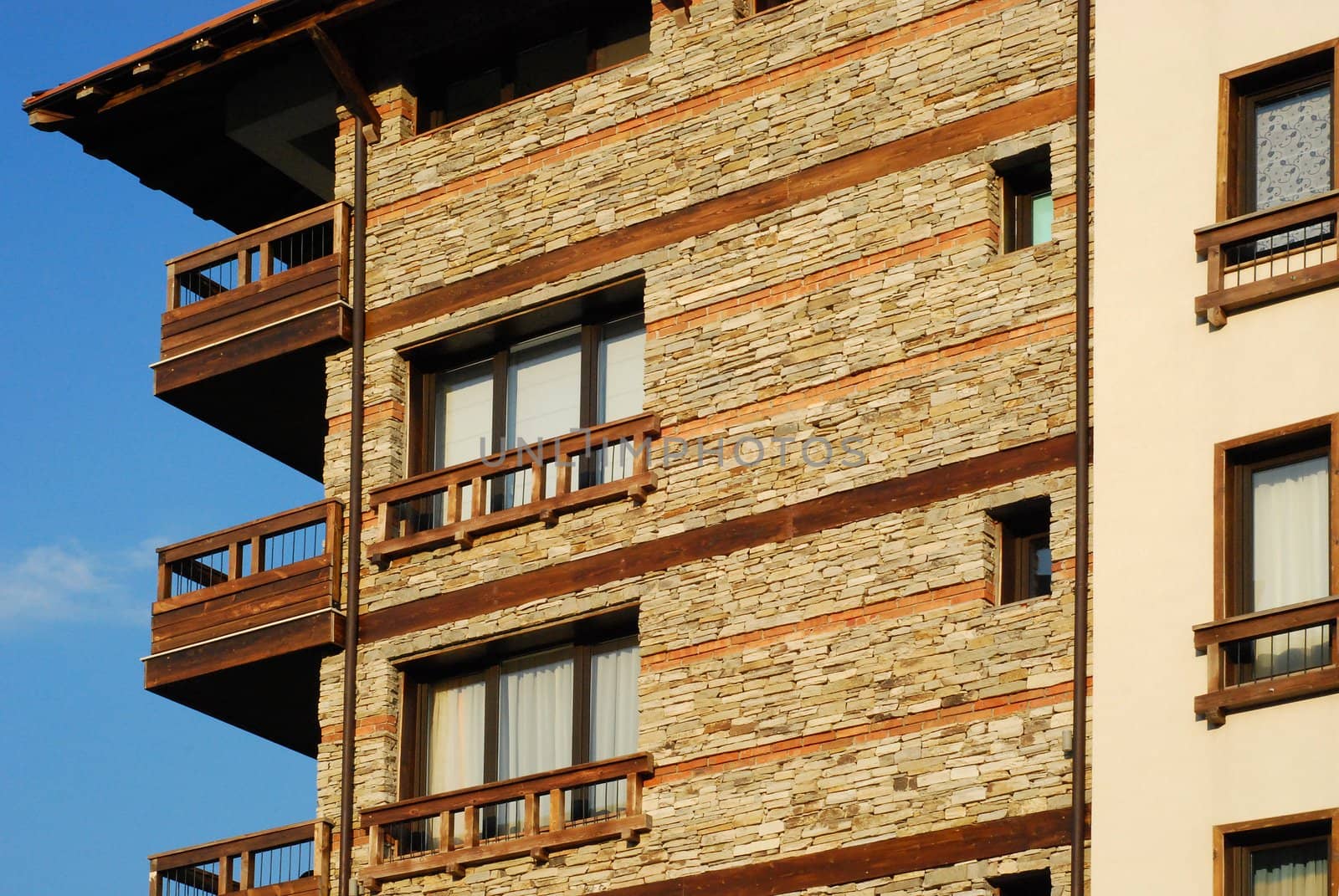 Mountain resort hotel stonewall, wooden details close-up