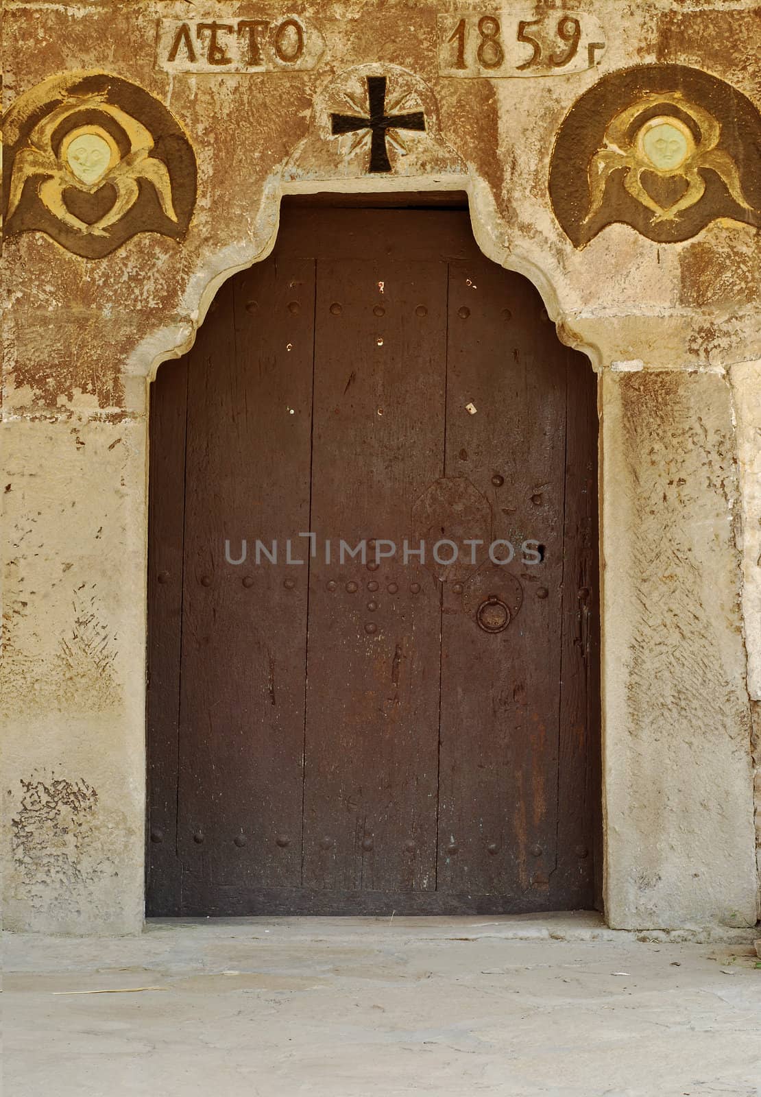 Old orthodox small village church side wooden door