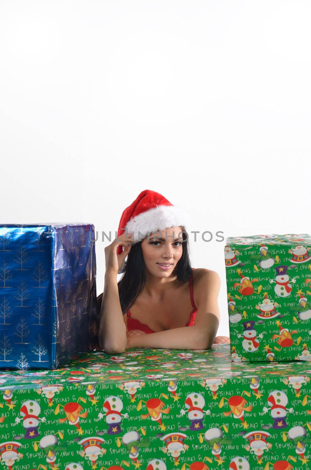 sexy santa surrounded by gifts