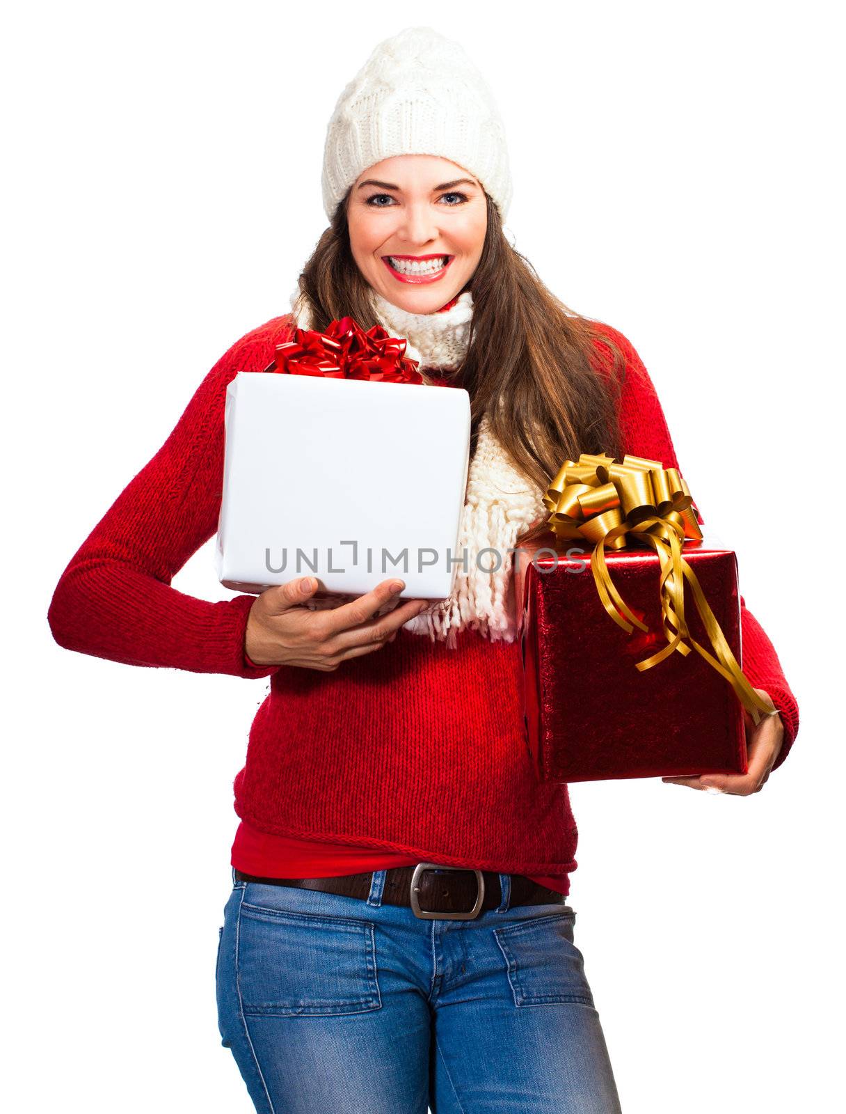 A very happy and beautiful woman out shopping holding two Christmas presents. Isolated on white.