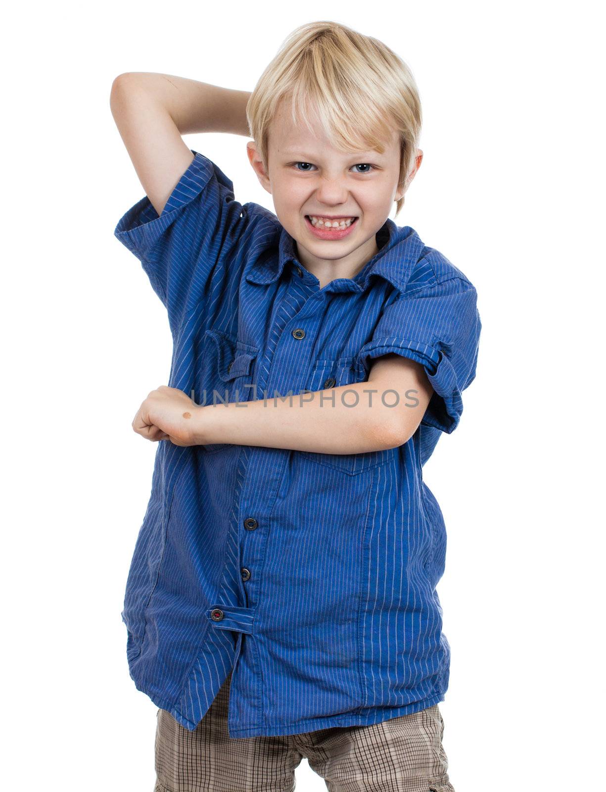 An aggressive young boy about to hit. Isolated on white.