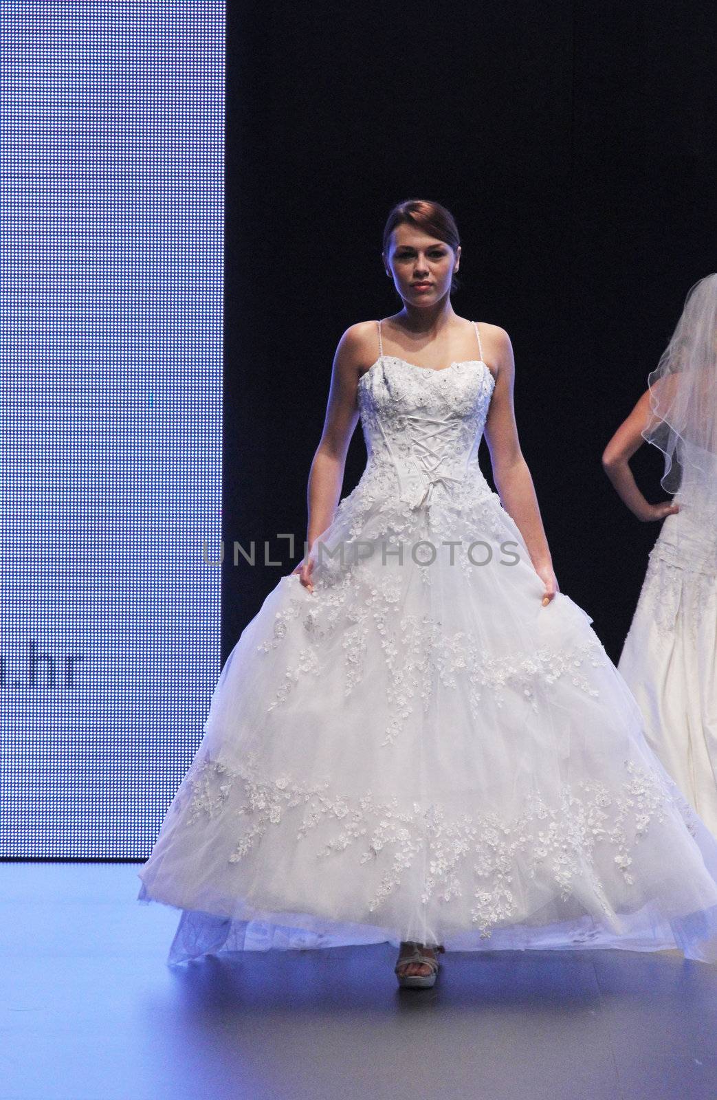 ZAGREB, CROATIA - OCTOBER 27: Fashion model wears wedding dress made by In Atelier Hera on 'Wedding days' show, October 27, 2012 in Zagreb, Croatia.