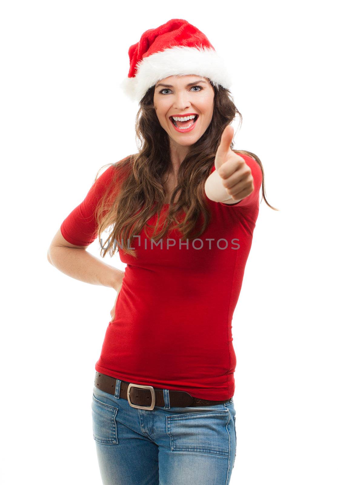 Beautiful young smiling woman wearing a Santa hat giving thumbs up. Isolated over white.