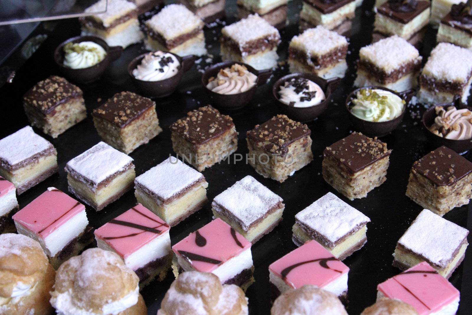Colorful desserts and pastry served on a wedding party