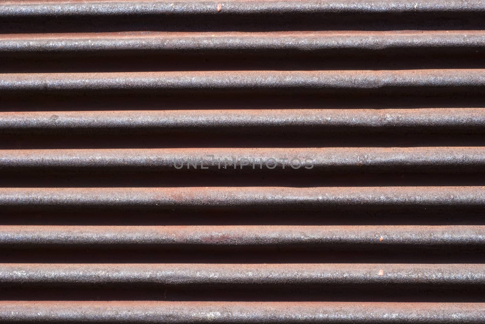 Old rusty corrugated  roller shutter fragment closeup as background