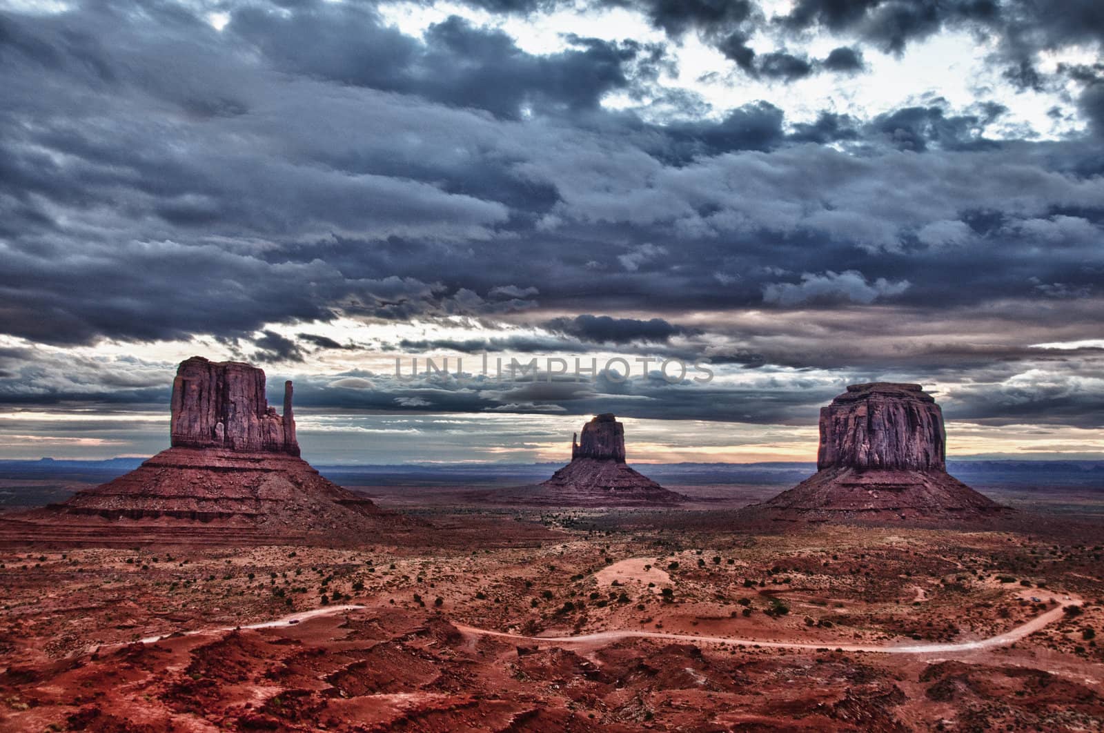 Monument valley cloudy colorful sunrise landscape view, USA