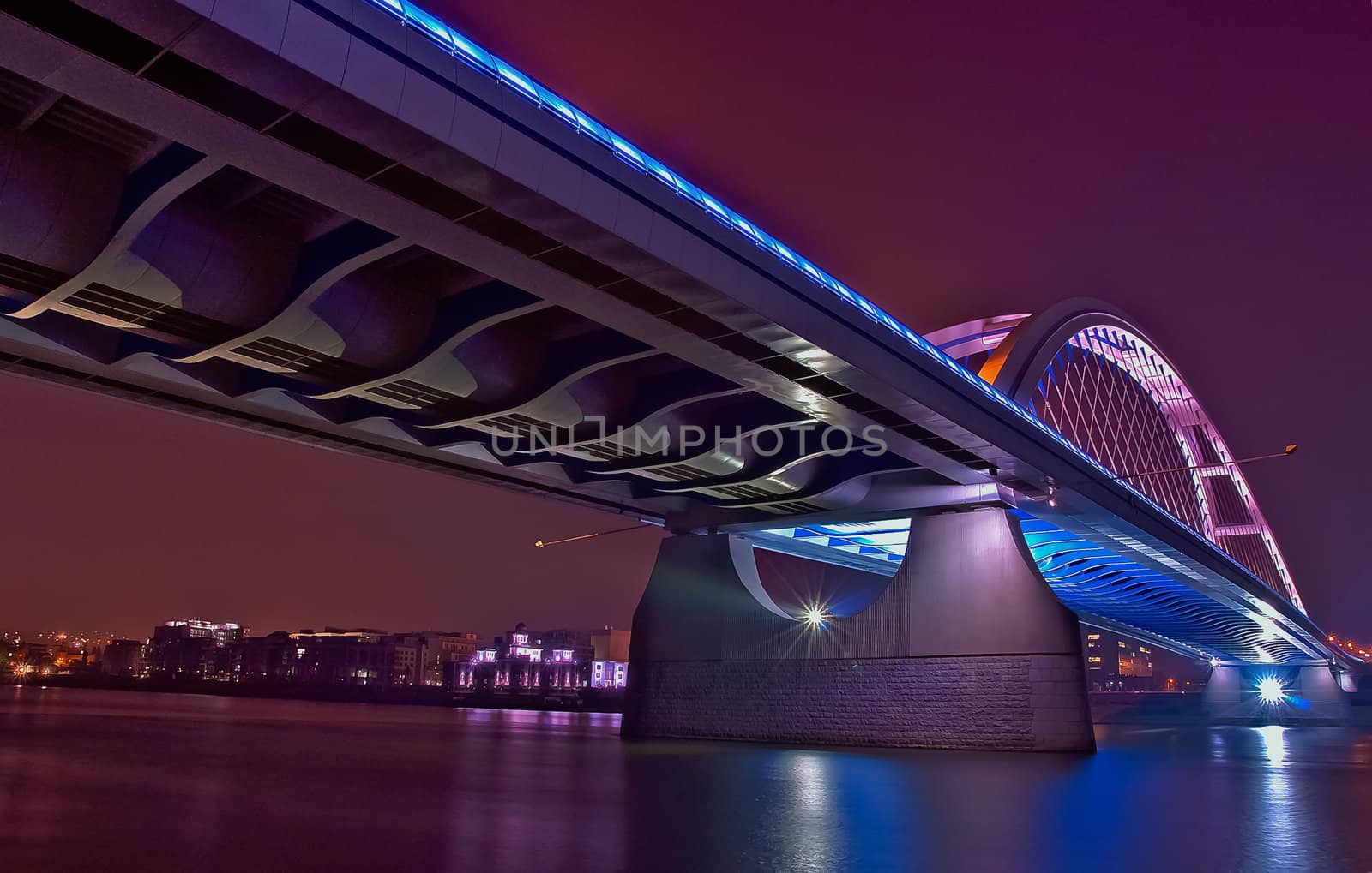 River bridge at colorful night, Apollo bridge over Danube river, Bratislava, Slovakia