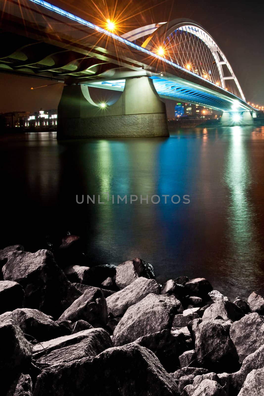 River bridge at colorful night, Apollo bridge over Danube river, Bratislava, Slovakia