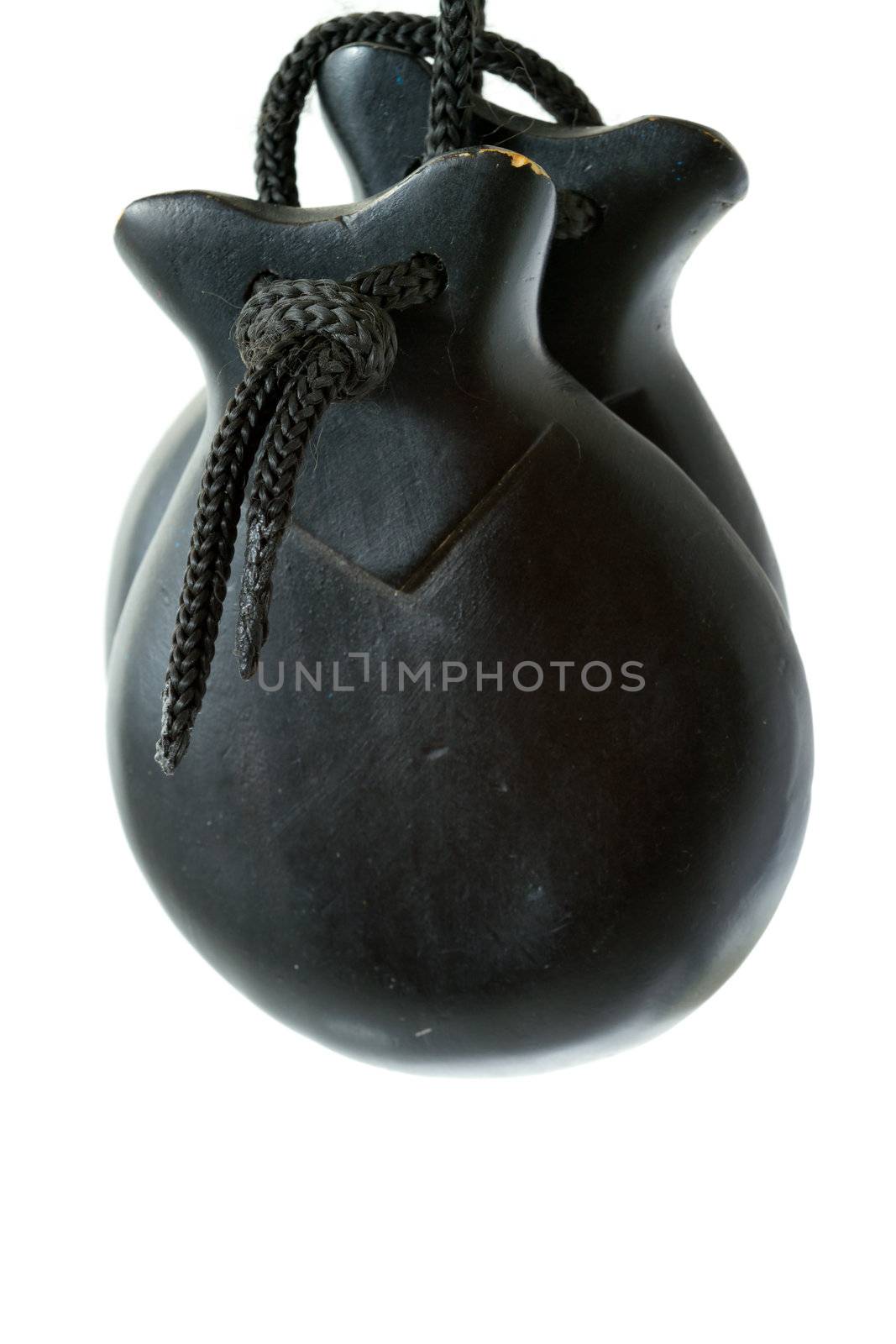 Black castanets on white background