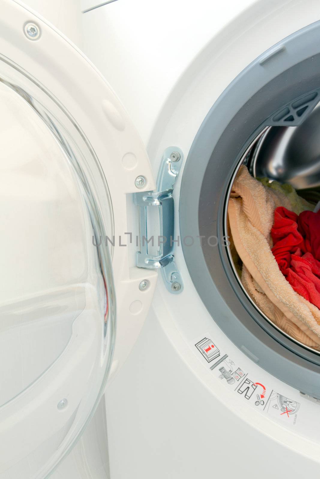 White washing machine with open door