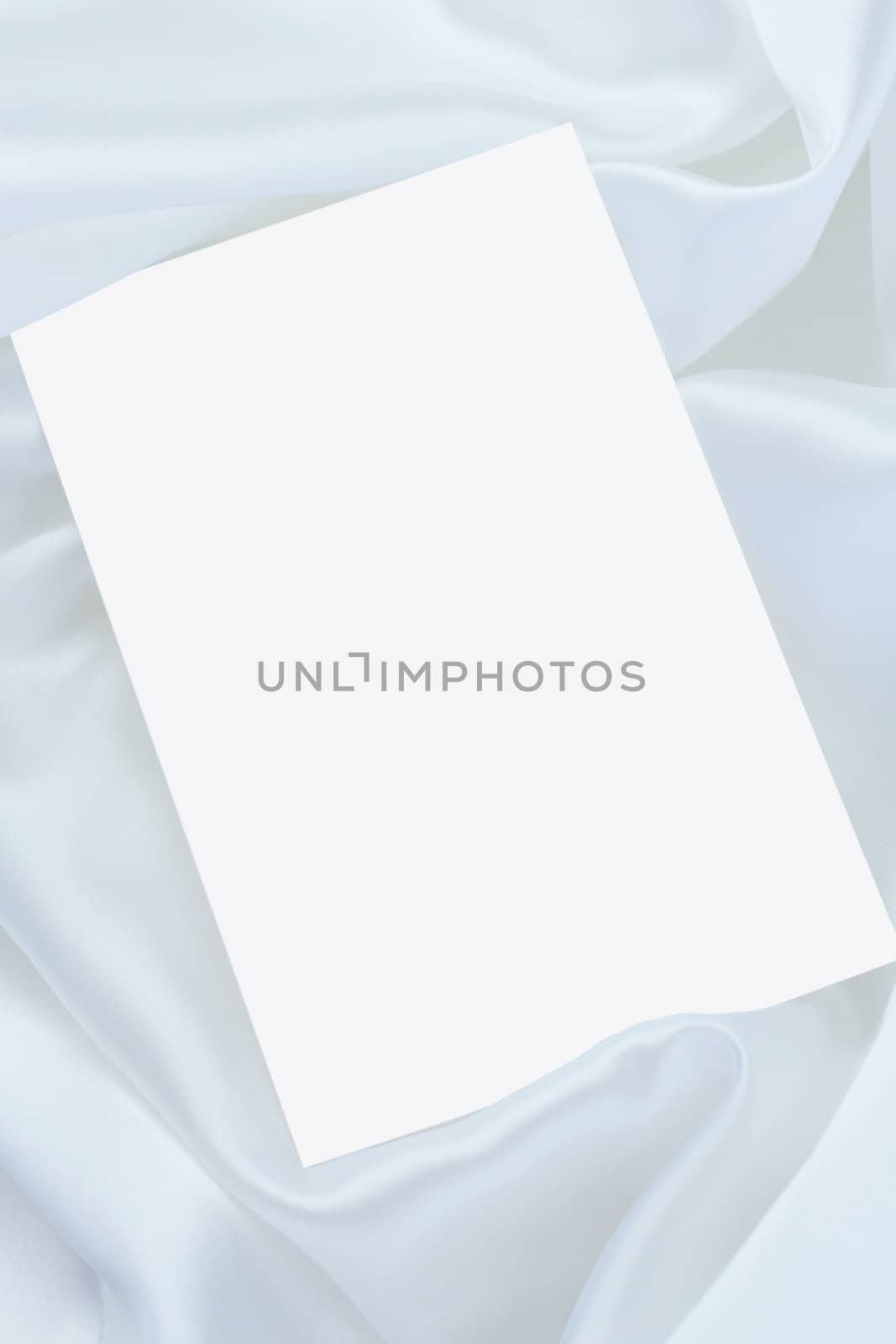 White blank card on white satin
