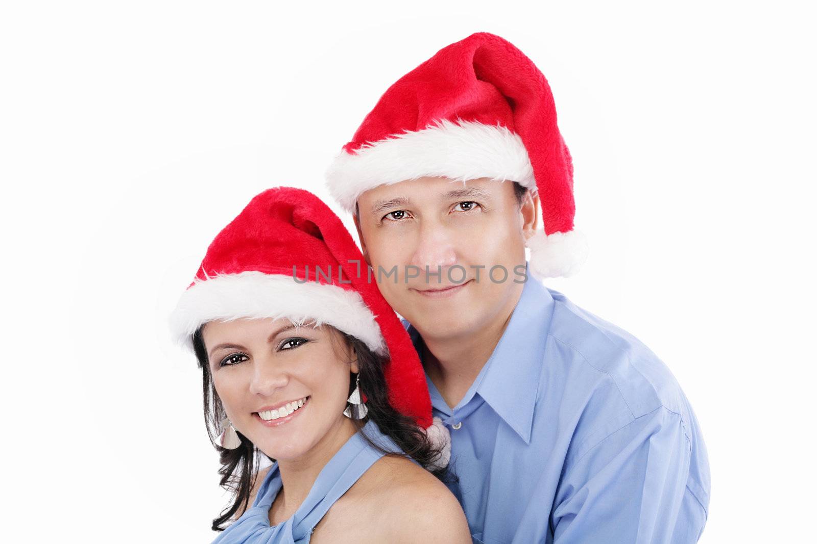 Young happy lovely couple wishing a merry christmas by dacasdo