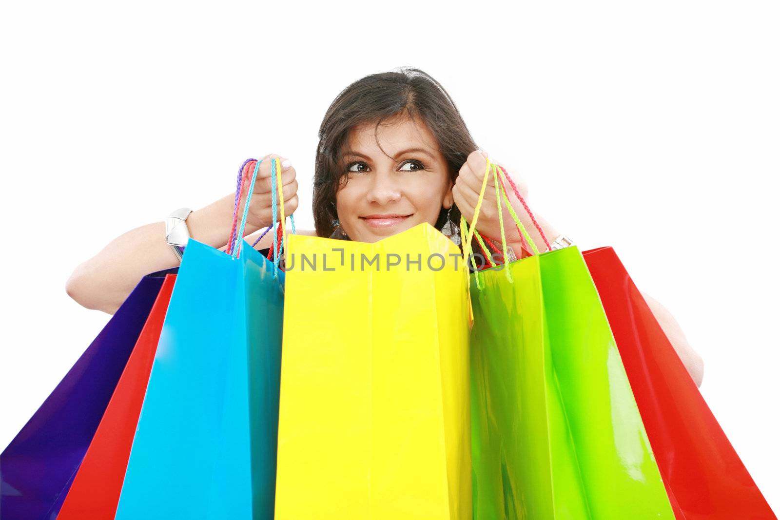 Beautiful shopping woman holding bags isolated over white backgr by dacasdo