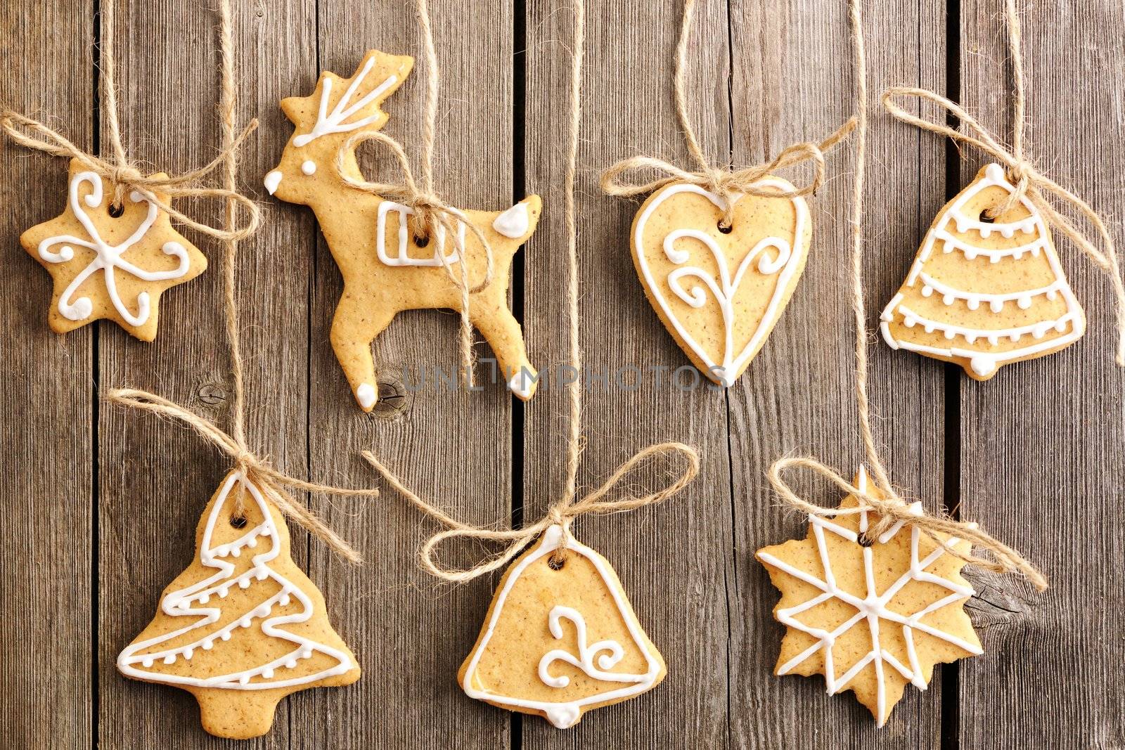 Christmas homemade gingerbread cookies over wooden table