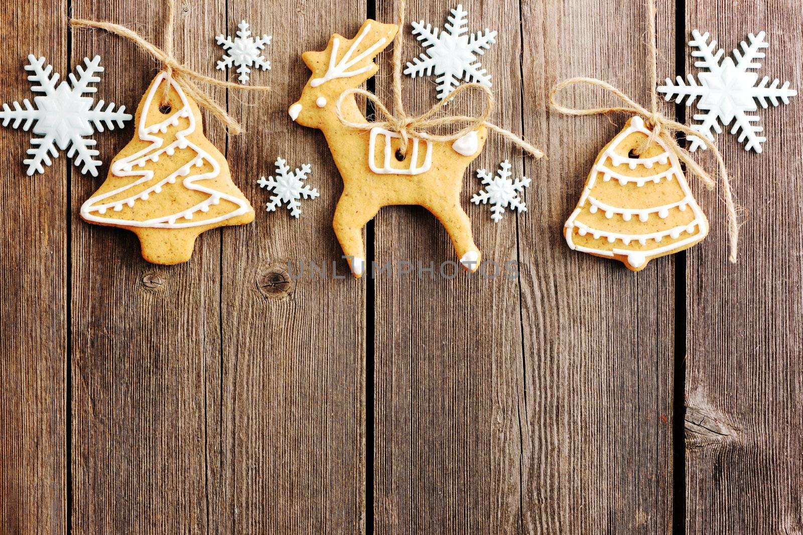 Christmas homemade gingerbread cookies over wooden table