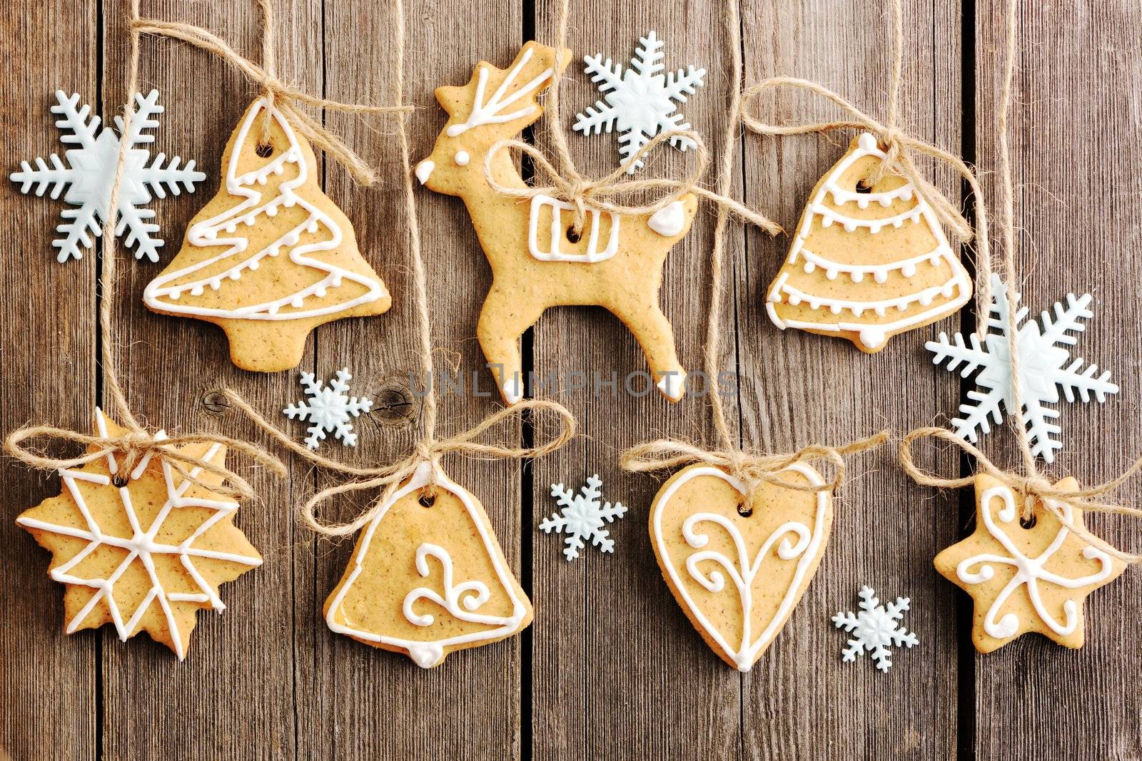 Christmas homemade gingerbread cookies over wooden table
