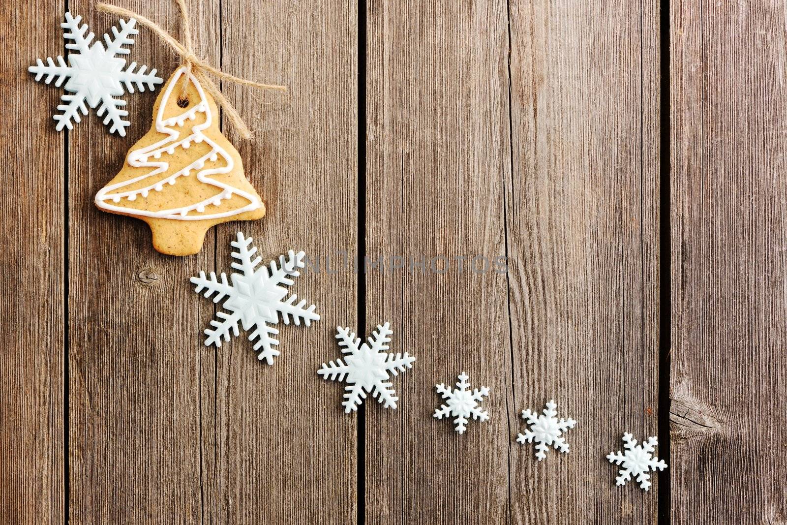 Christmas homemade gingerbread cookies over wooden table