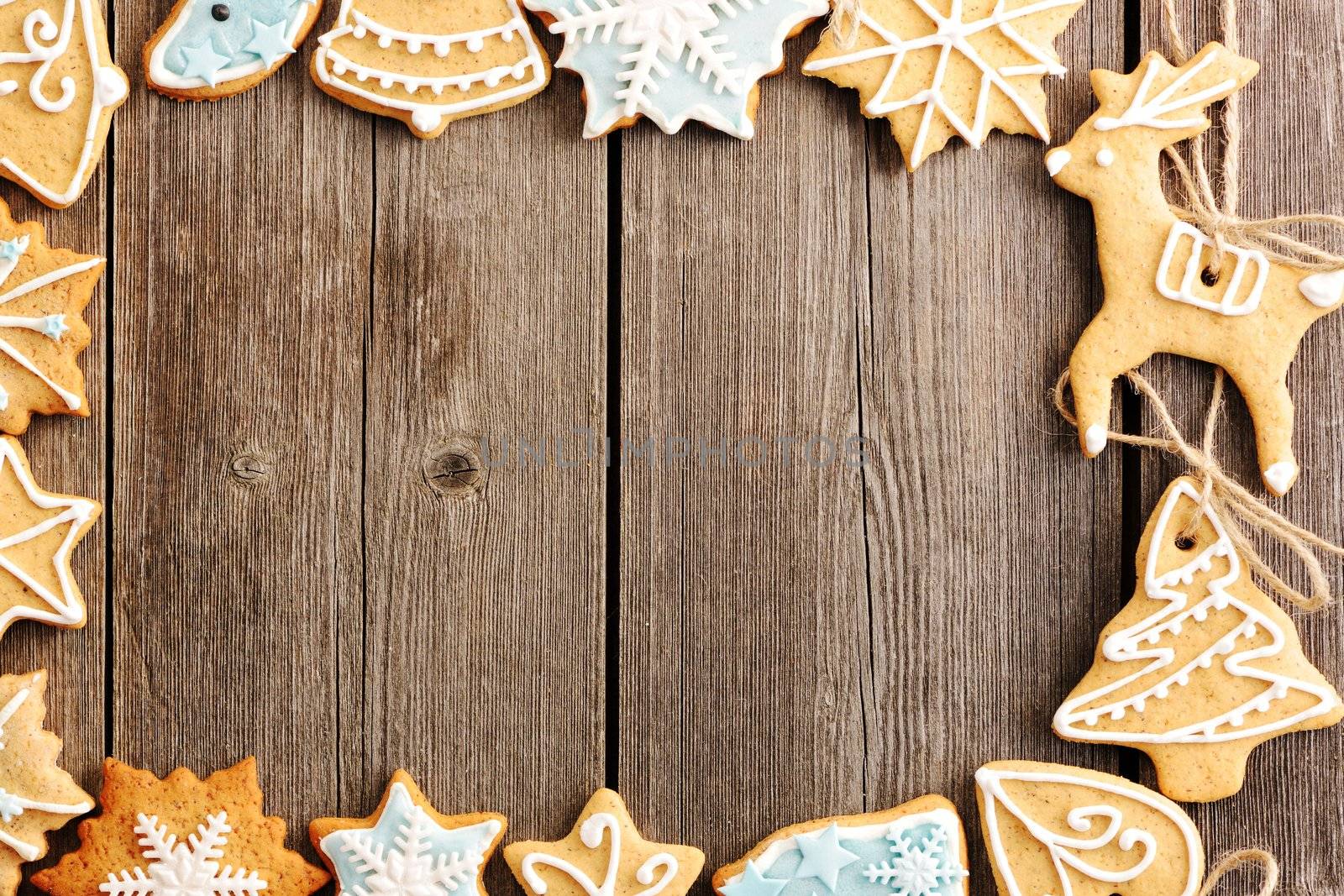 Christmas homemade gingerbread cookies over wooden table