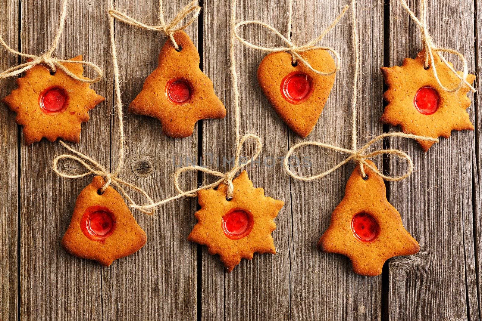 Christmas homemade gingerbread cookies over wooden table
