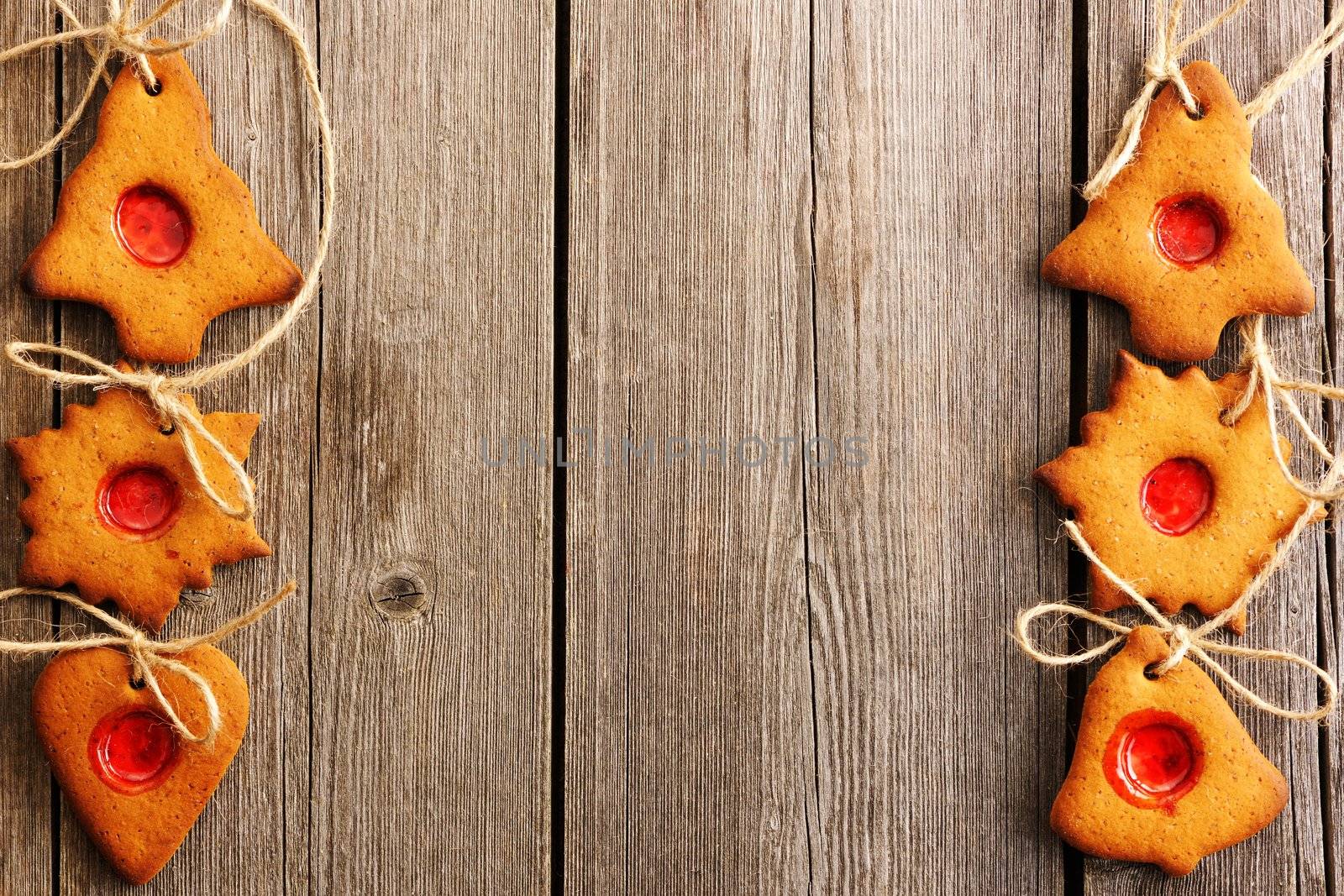 Christmas homemade gingerbread cookies over wooden table