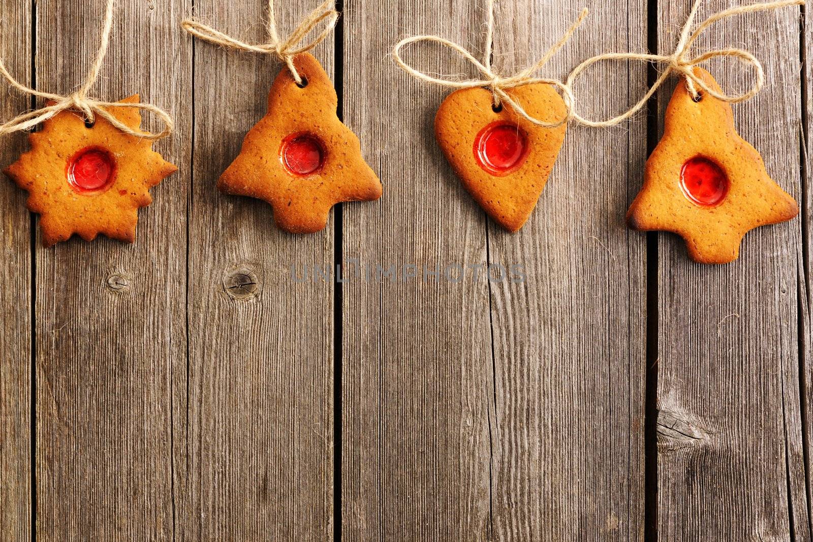 Christmas homemade gingerbread cookies over wooden table