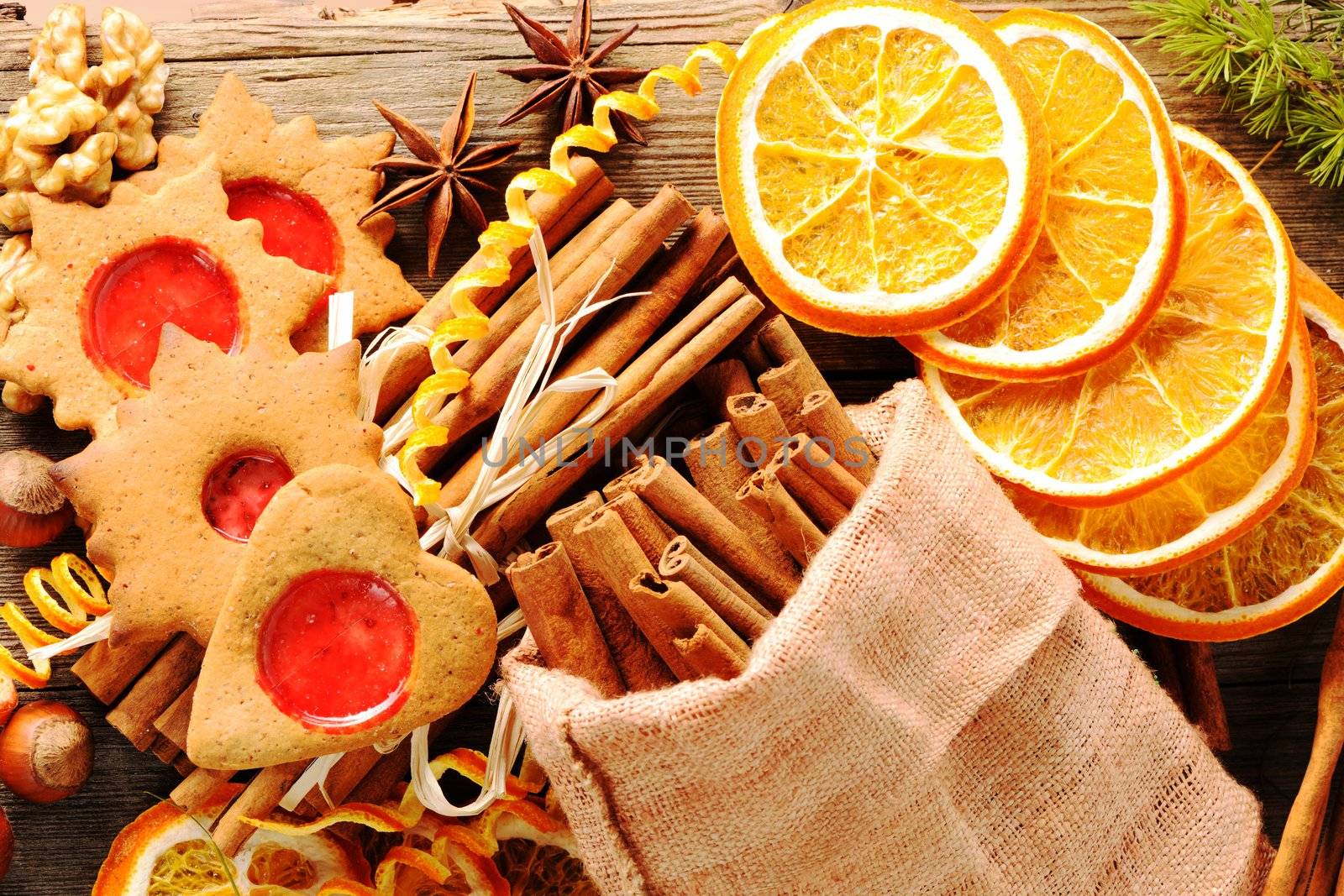 Christmas homemade gingerbread cookie and spices over wooden table